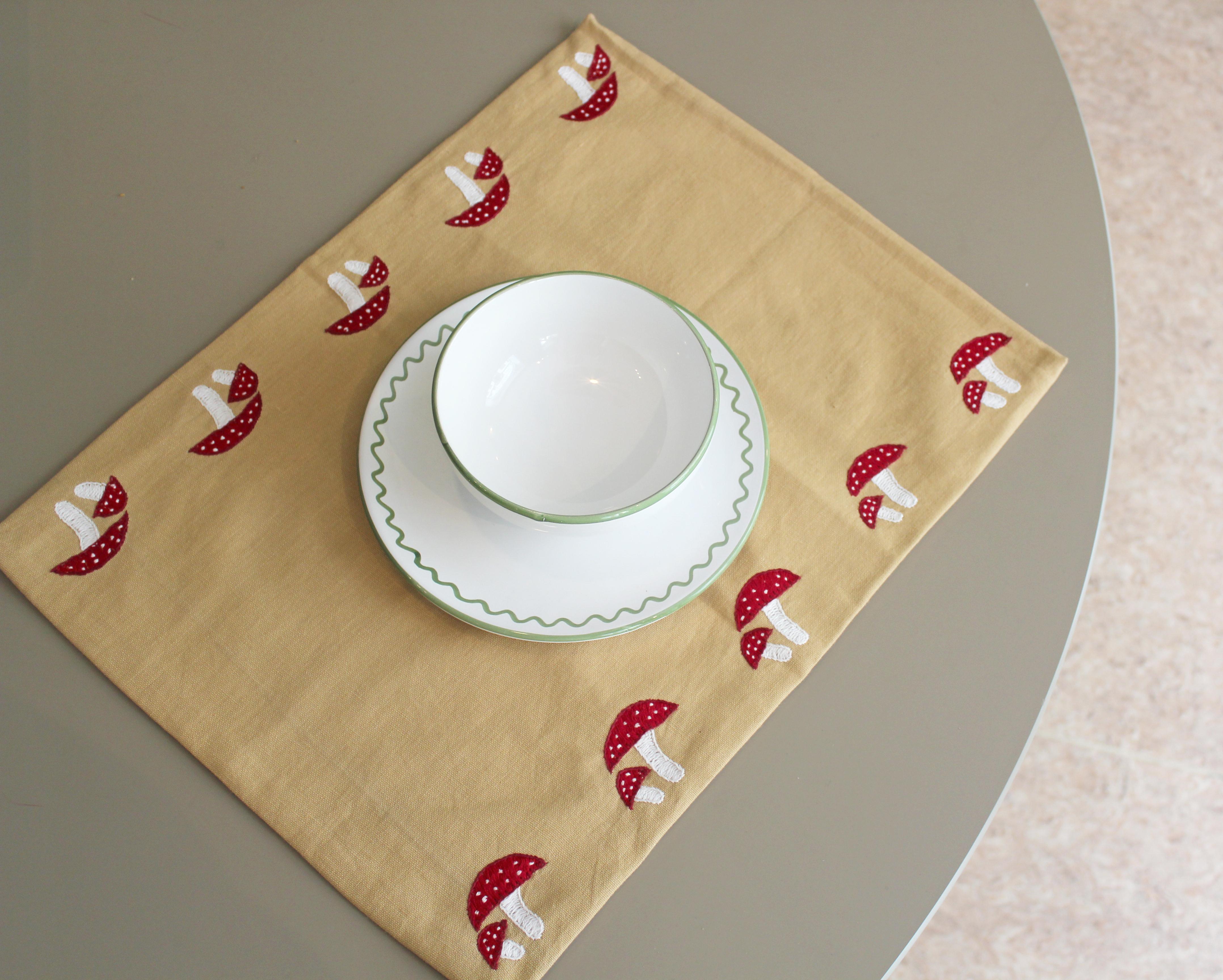Jore Copenhagens placemats with hand embroidery adds a bit of humor to every meal. We are in love with the little mushroom, and it is the perfect way of adding a bit of danger ( wink wink - it's poisonous) to the daily dinner party.

Care: 
We do