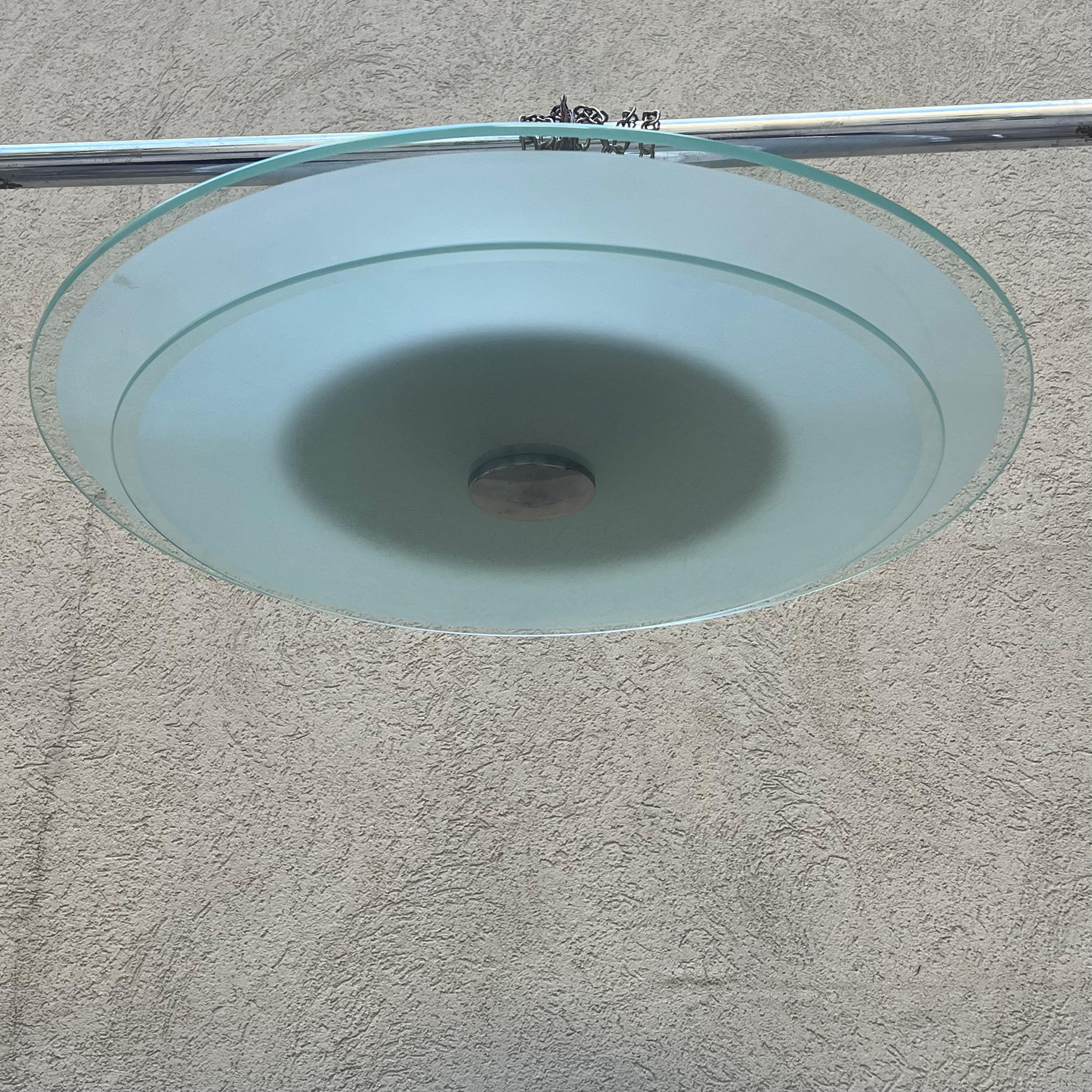 Large ceiling lamp consisting of two large overlapping discs made of etched glass, held up by a large aluminum stud. All elements that hark back to the Deco style, harking back to works by Ponti or Fontana Arte. But this ceiling lamp was made