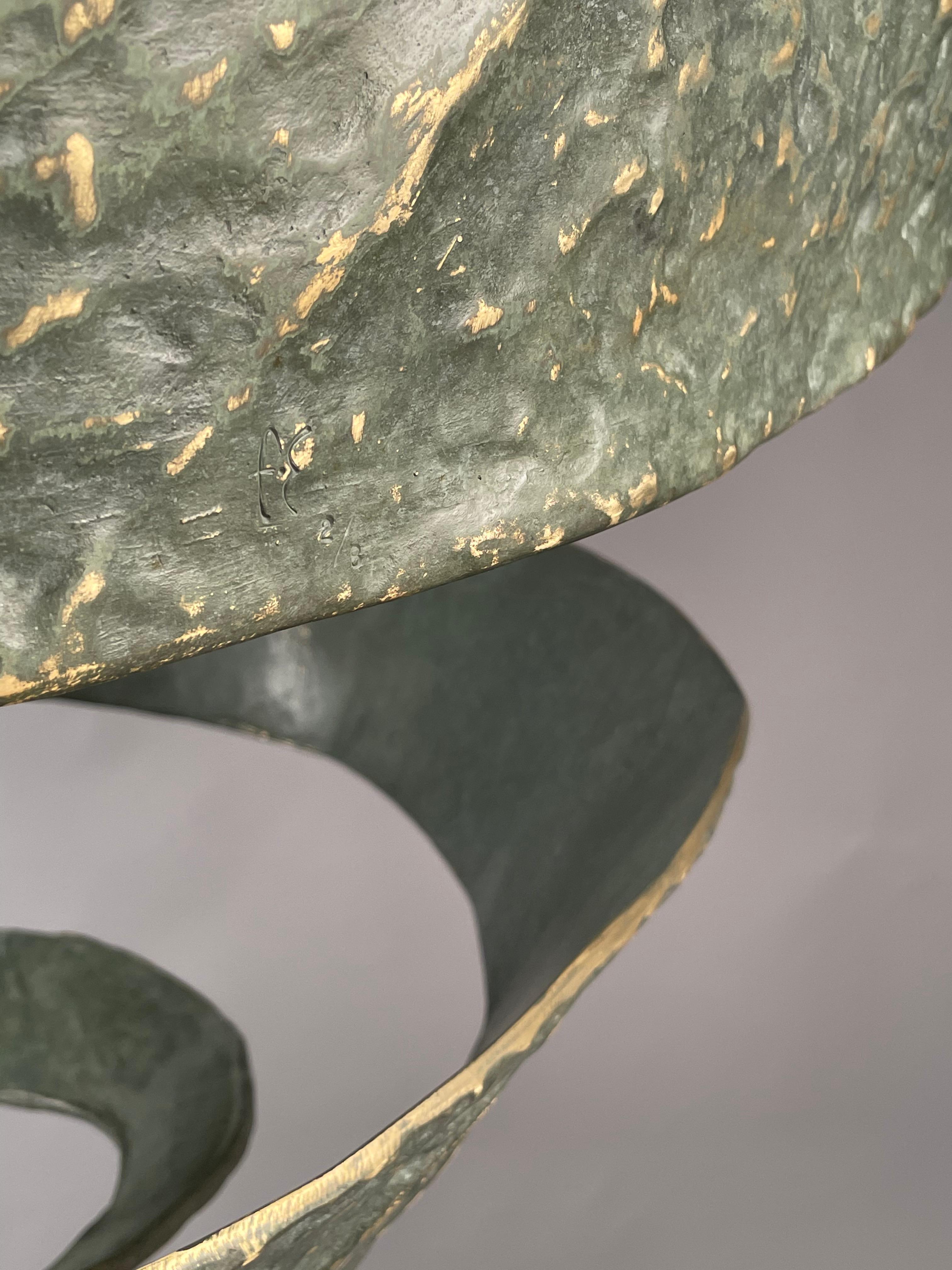 Green patinated bronze “swirl” fixture, inspired by an orange peel. The fixture will be suspended from a ceiling-mounted brass frame, which can be painted to match the ceiling. Three sockets sit inside the bottom. Weight approx. 250 lbs
Custom