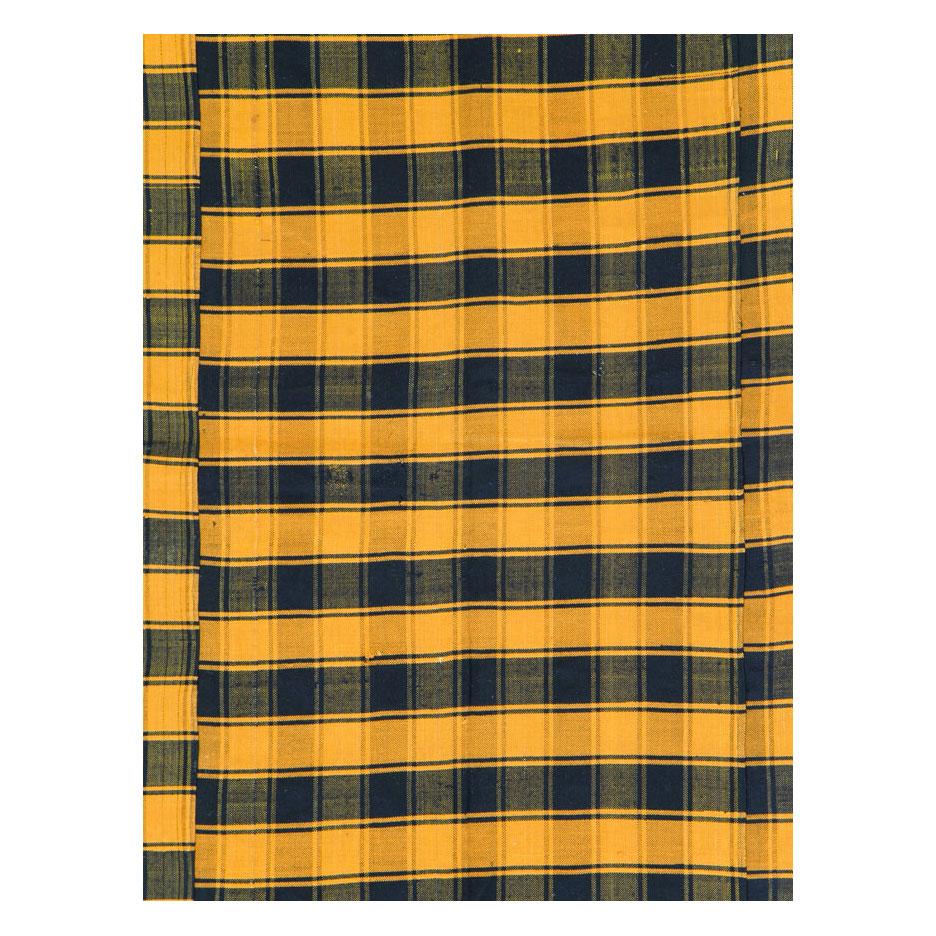 A vintage Turkish flat-weave Kilim room size accent rug handmade during the mid-20th century with a plaid design in goldenrod and dark blue.

Measures: 6' 0