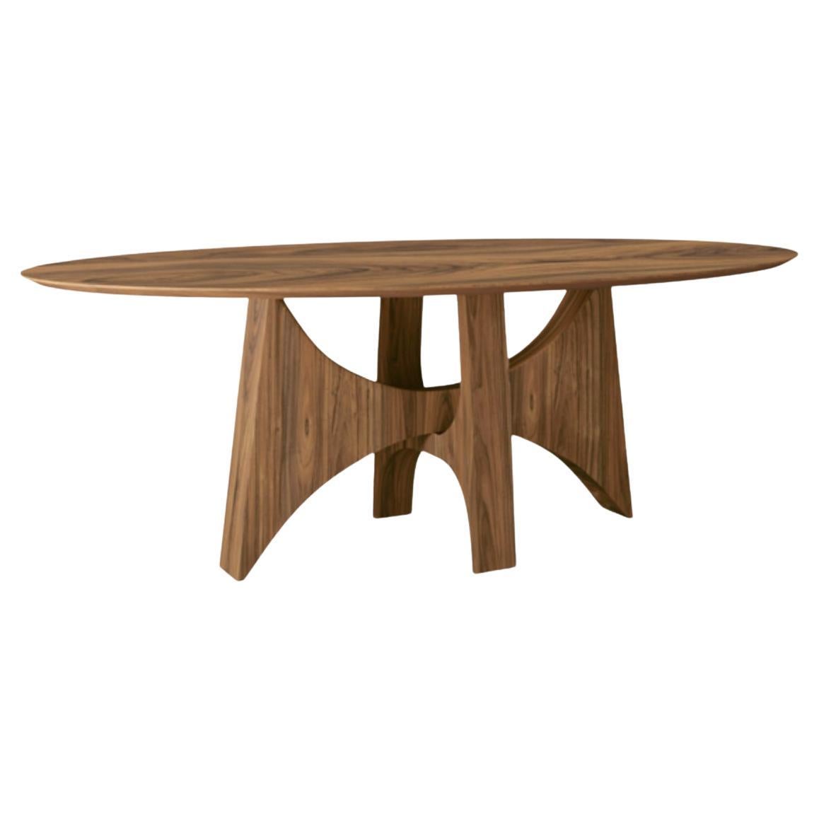 "Planalto" oval dining table in natural walnut wood