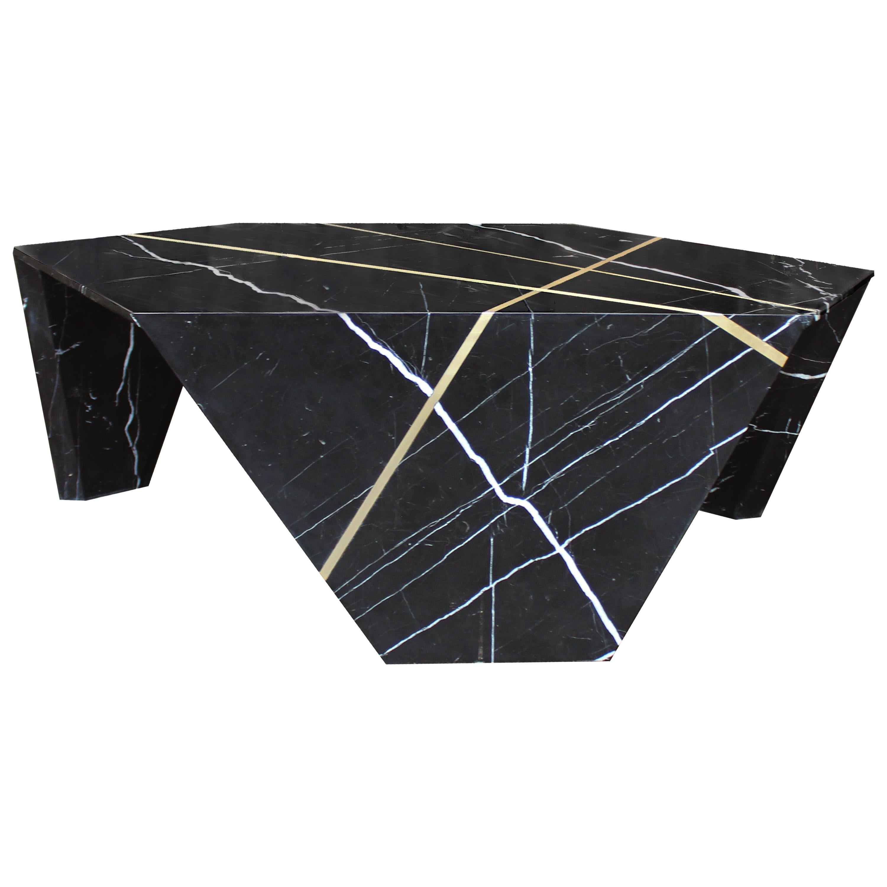 James Devlin Studio’s planar cocktail table combines single slab marble with inlaid bronze to create a uniquely beautiful stone origami sculpture. Each piece begins with a single marble slab cut and mitered into customizable geometric shapes that