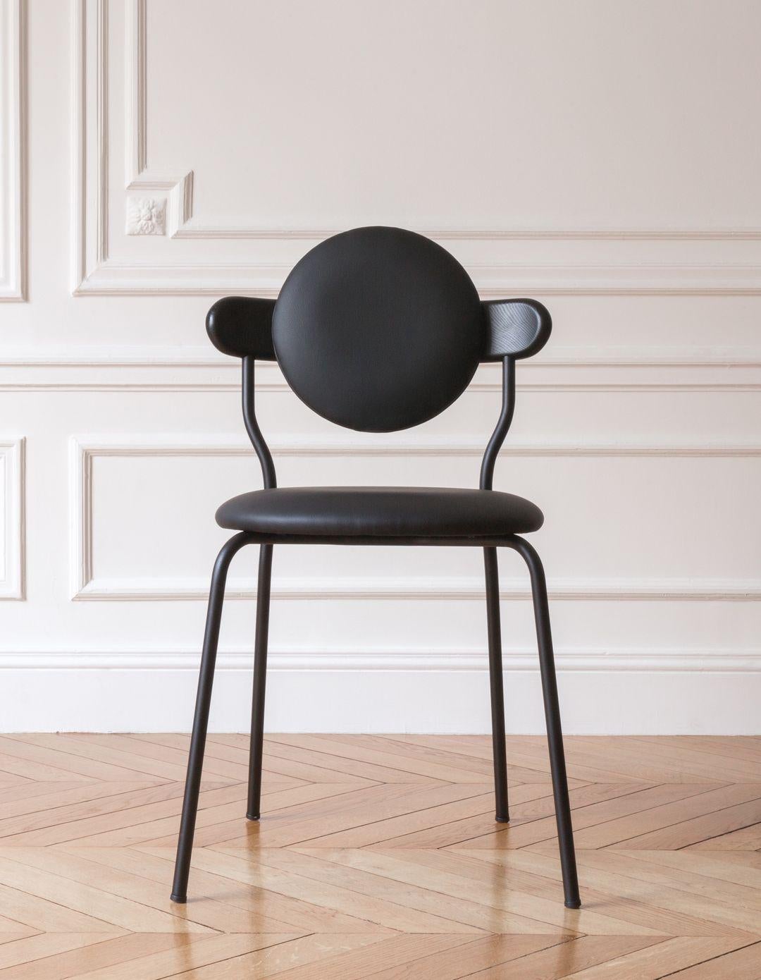 Planet is an upholstered chair inspired by the distinctive silhouette of planet Saturn. The upholstered seat and back ensures a high level of comfort, but Planet chair remains a featherweight at only six kilos for practical use every day.

It is