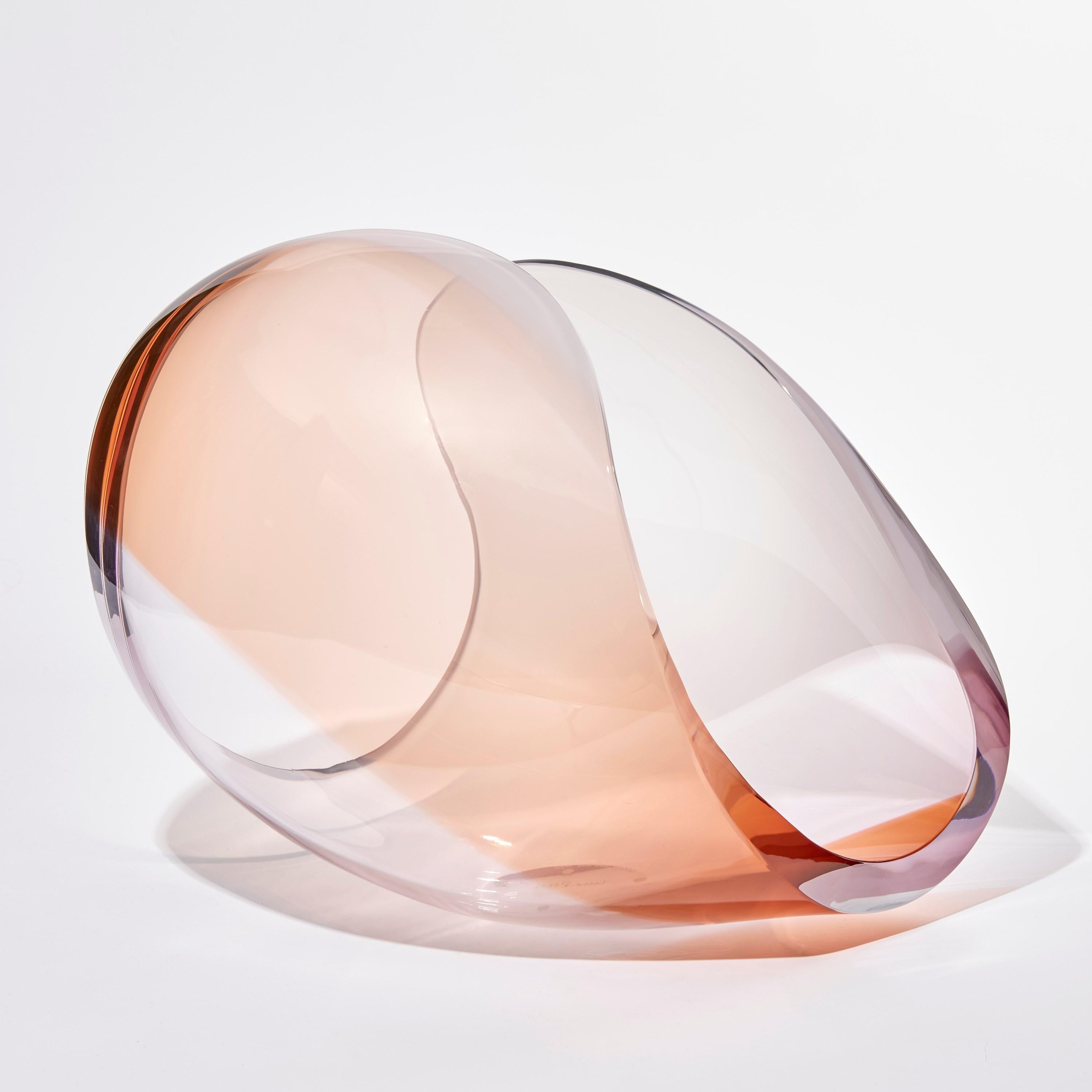 Planet in Amber & Pink is a unique glass sculptural artwork and centerpiece by the Swedish artist Lena Bergström. This piece is from an ongoing collection of works called the Planets which the artist has revisited several times throughout her