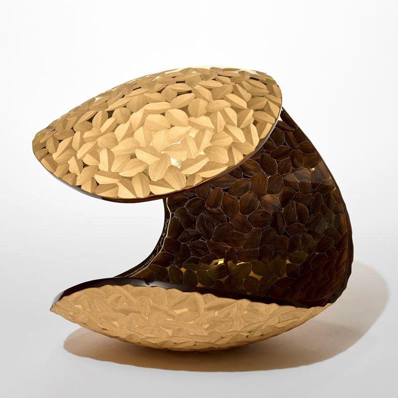 'Planet in Faceted Gold & Amber' is a unique artwork by the Swedish artist and designer, Lena Bergström. It is from an ongoing collection of works called 'Planets', which Bergström has revisited several times throughout her extensive and highly