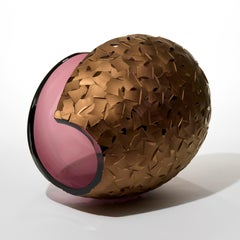 Planet in Faceted Gold & Aubergine, a cut glass sculpture by Lena Bergström