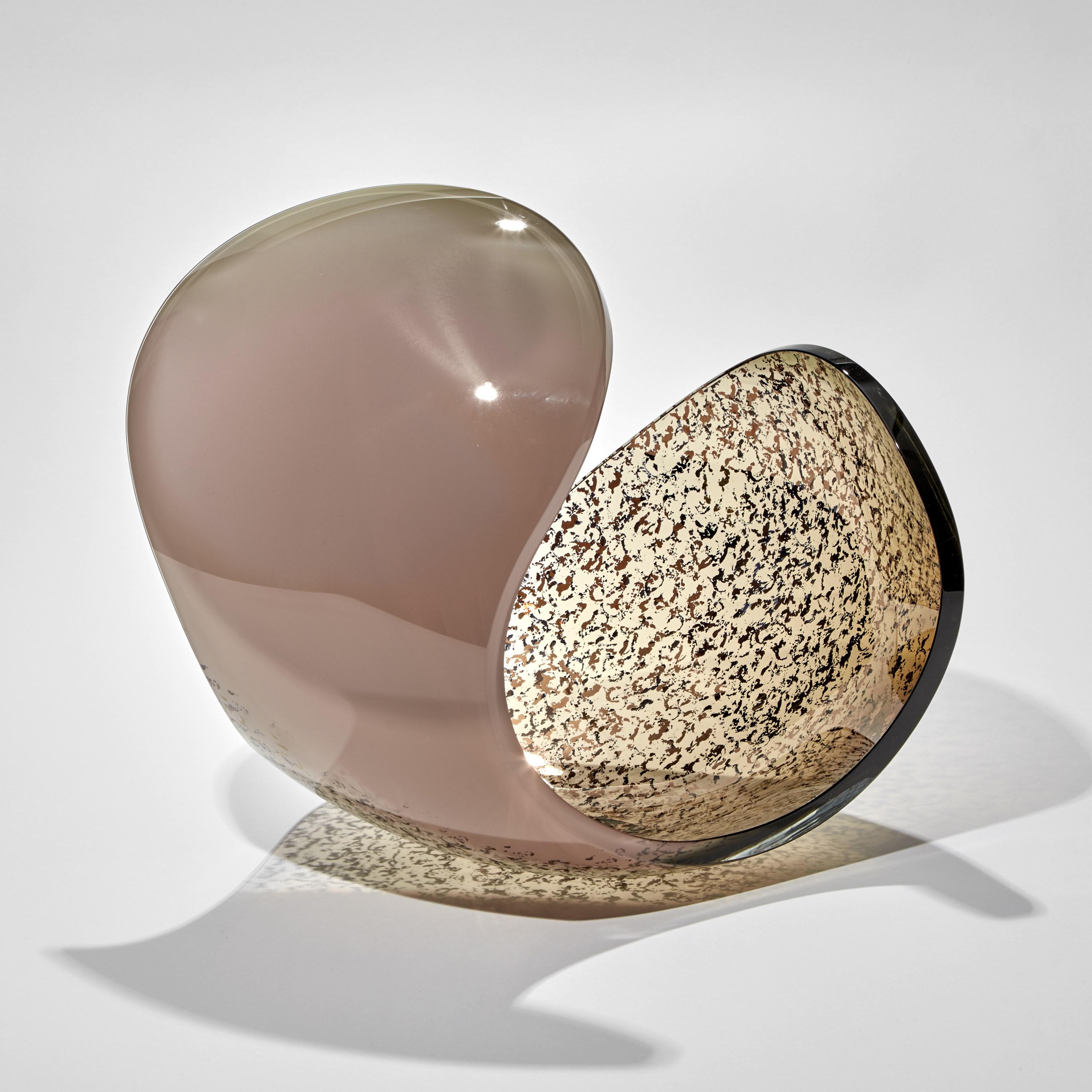 'Planet in Pink, Brown & Gold' is a unique glass sculptural artwork and centerpiece by the Swedish artist Lena Bergström. This piece is from an ongoing collection of works called the Planets which the artist has revisited several times throughout
