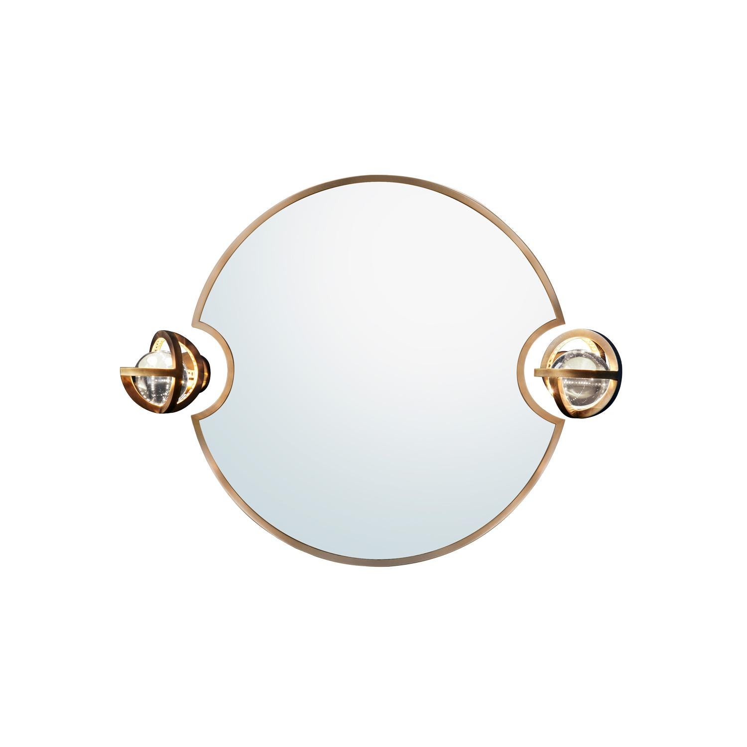 New addition to Planetaria collection, this round mirror has two smaller round cut outs on the sides. The mirror was created to accompany the Planetaria wall lights, however it can stand by itself.

Please note that the mirror is handmade and some