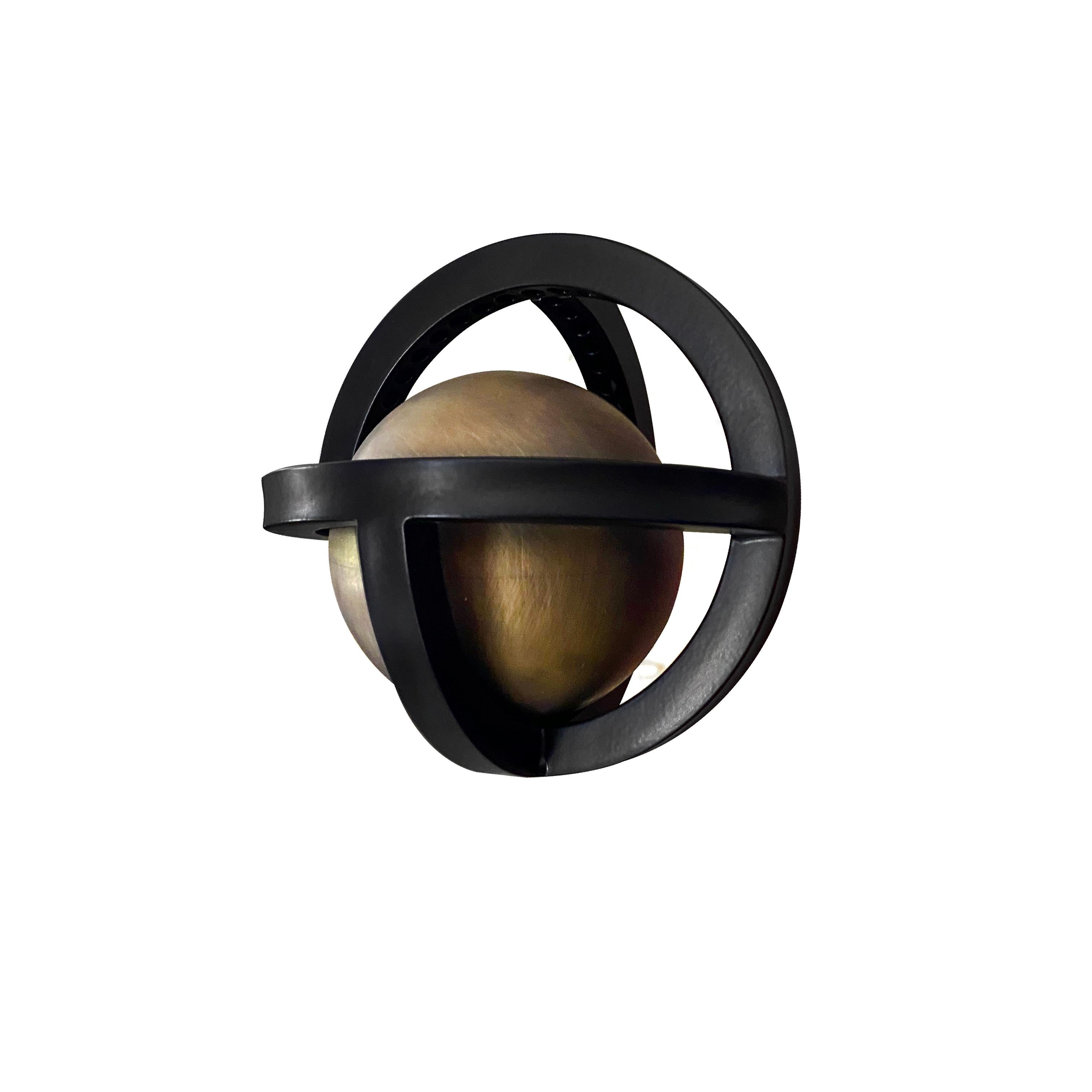 New addition to Planetaria collection. Both geometric and organic, the light represents an exploration of the globe created by folding and rotating three flat circles to create a single sphere, encasing a reflective orb.

The light is illuminated