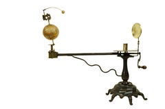 Mechanical planetarium representative of the solar system with Sun Earth and Moon