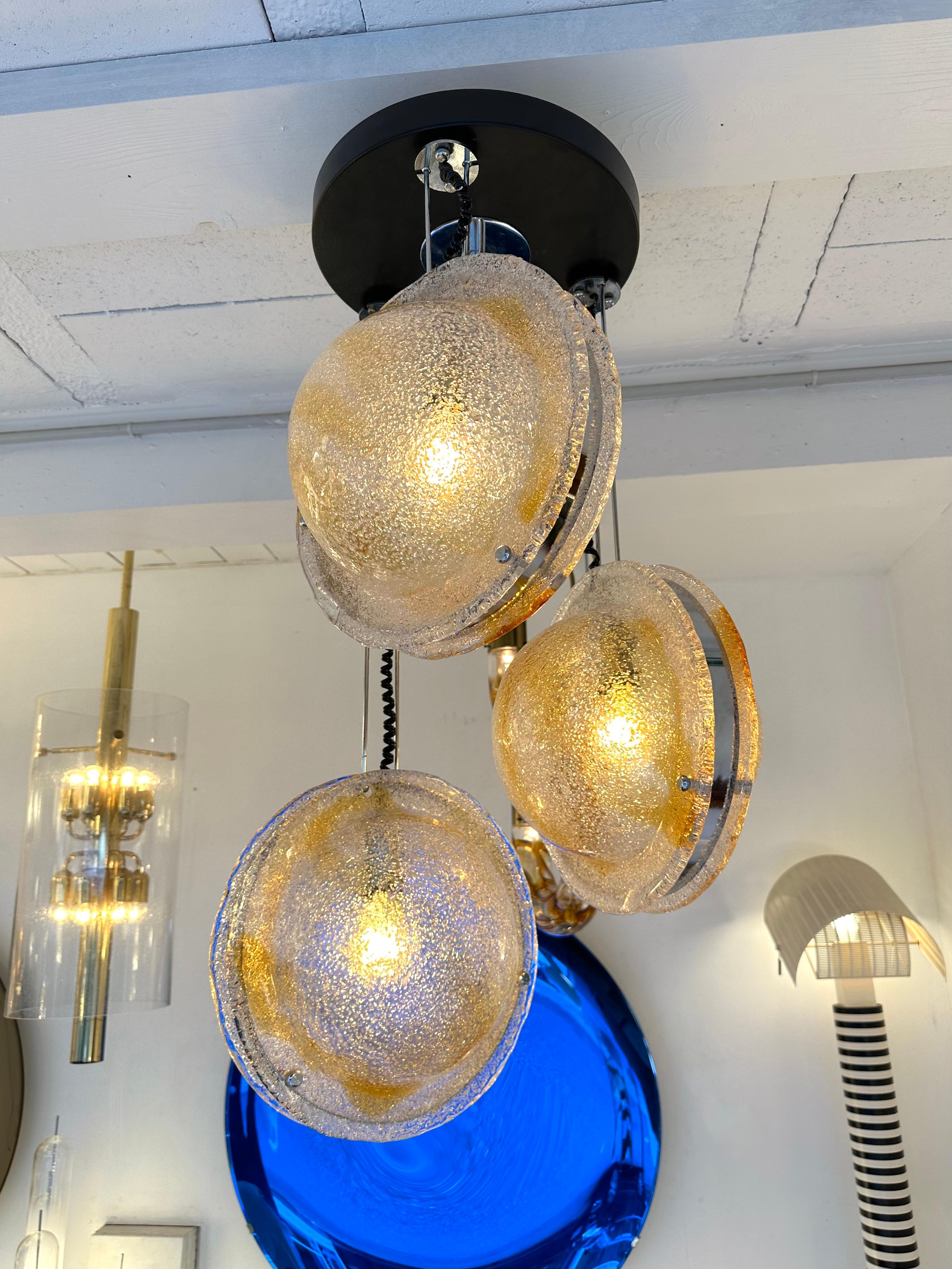 Mid-Century Modern Space Age Cascade planetarium saturn Chandelier ceiling pendant light lightning lamp in amber and clear Murano glass ball sphere globe and metal chrome structure by the manufacture VeArt. Famous manufacture like Mazzega,  Venini,