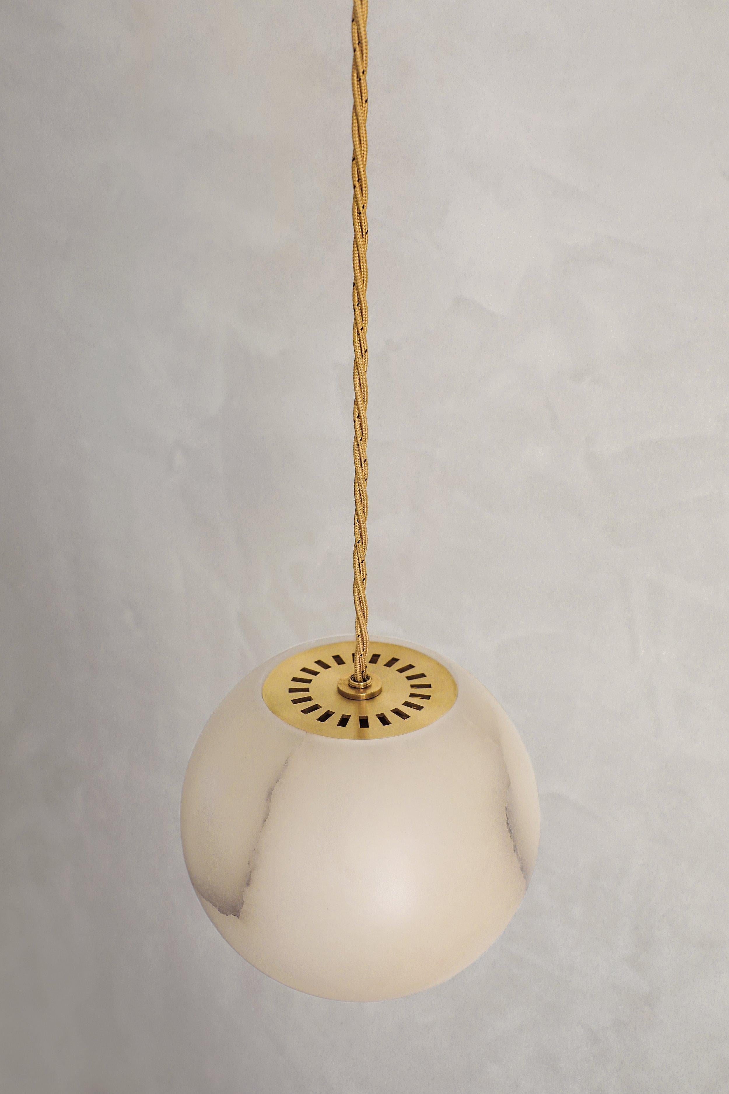 Planette Cable 12 Pendant by Contain
Dimensions: Ø 12 x H 100 cm (custom lenght).
Materials: Alabaster, brass, optical lens.

Also available in different finishes and dimensions (Ø12 cm / Ø16,5 cm / Ø18 cm x custom length). Please contact