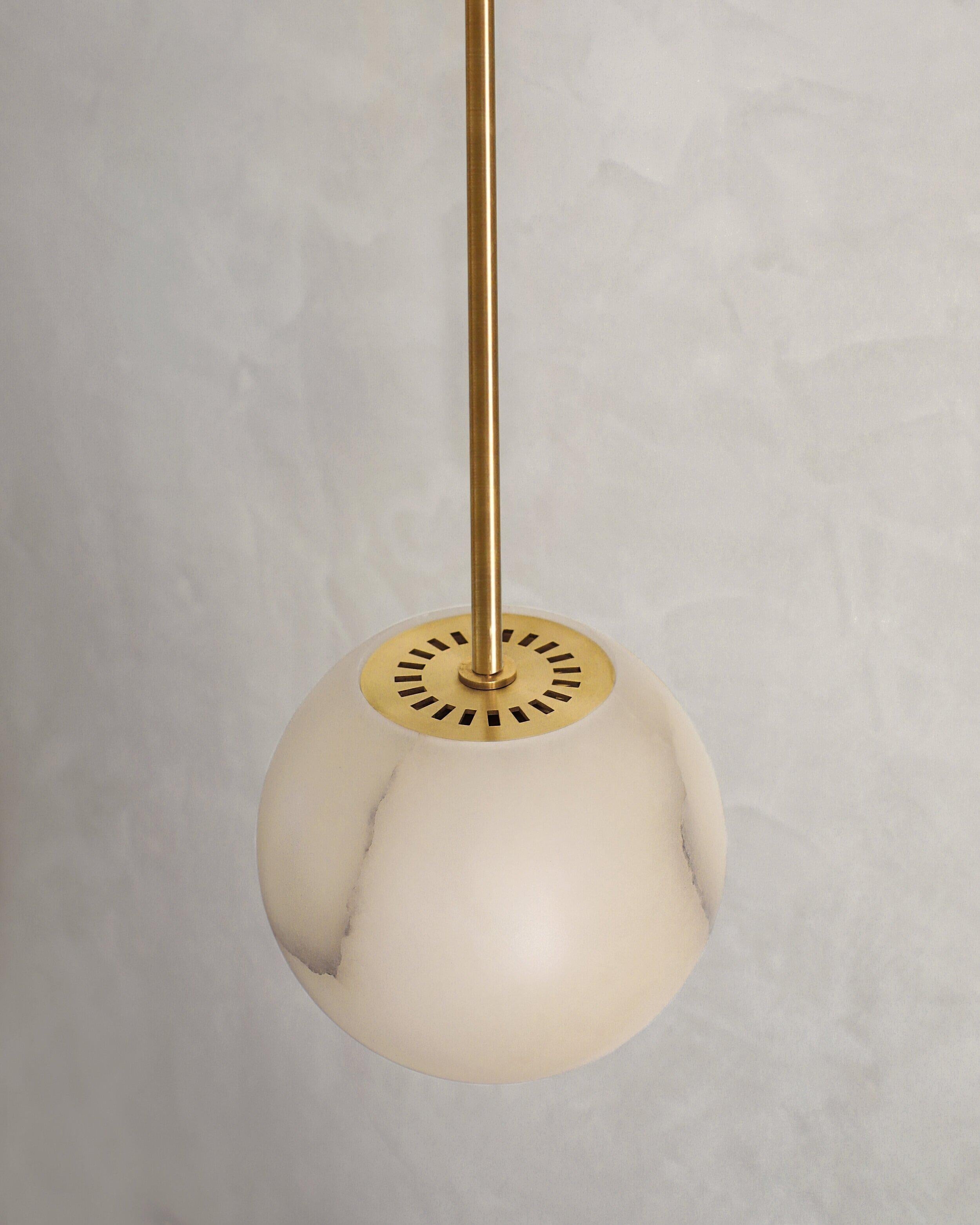 Planette tube 12 pendant by Contain.
Dimensions: D 12 x H 100 cm (custom lenght).
Materials: alabaster, brass.
Also available in different finishes and dimensions (Ø12 cm / Ø16,5 cm / Ø18 cm / Ø22 cm x custom length).

All our lamps can be wired