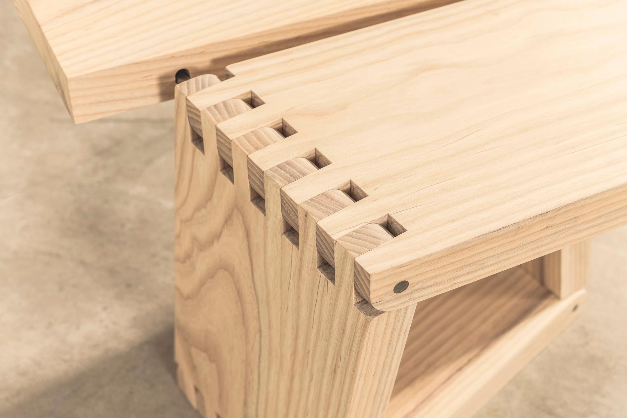 Created from one piece of solid ash. When open it looks like a plank with the grain still running through the joints. With a few folds, it transforms into a stool or side table. 

Designed and developed in 1994 by Thomas Heatherwick, in