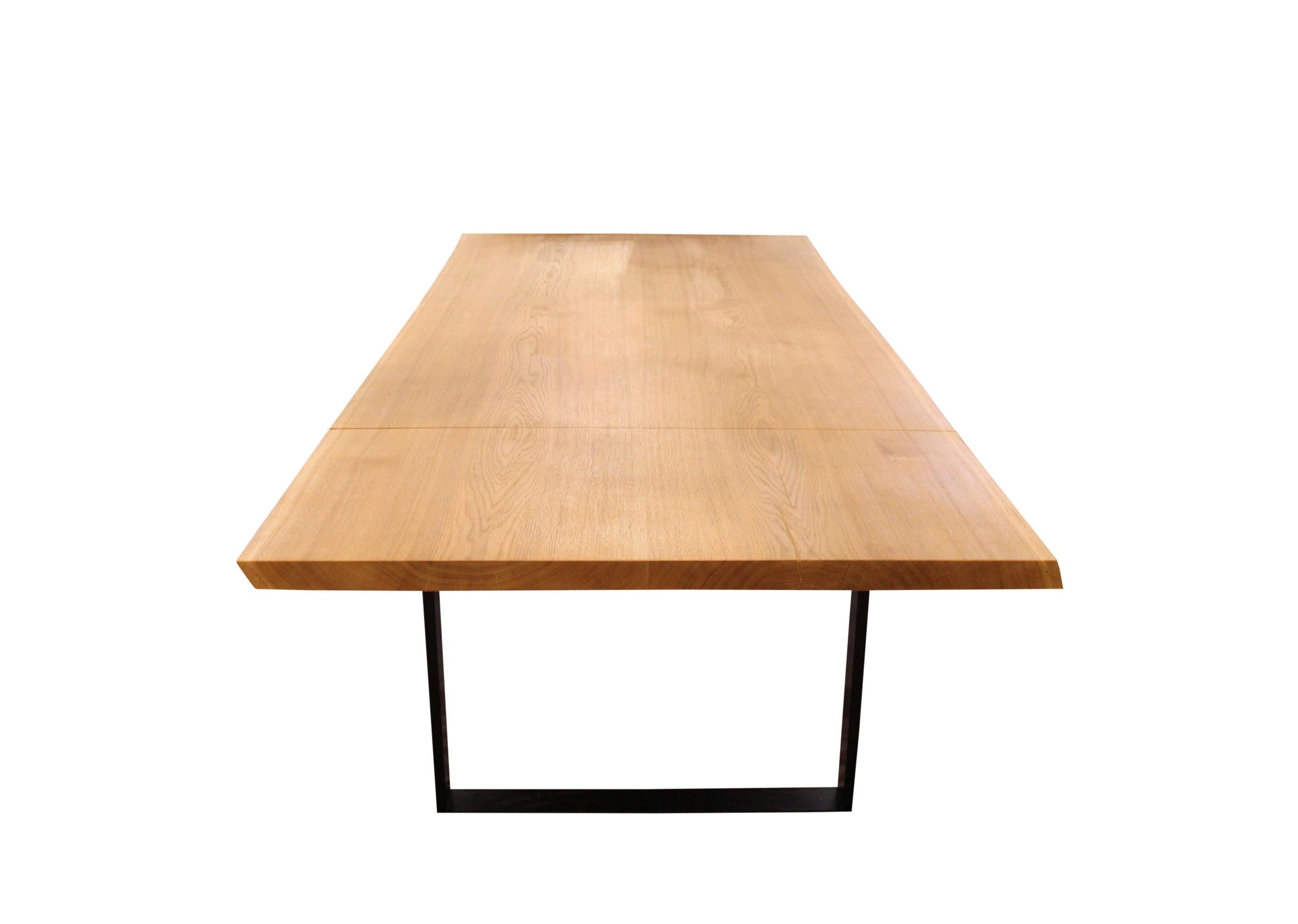 Plank table of oak and black metal frame, made of two planks with natural edges and two extension leaves. The table is of our own design and newly manufactured.
Measures: H 75 cm, W 260 cm and D 105 cm.

We can manufacture plank tables after order