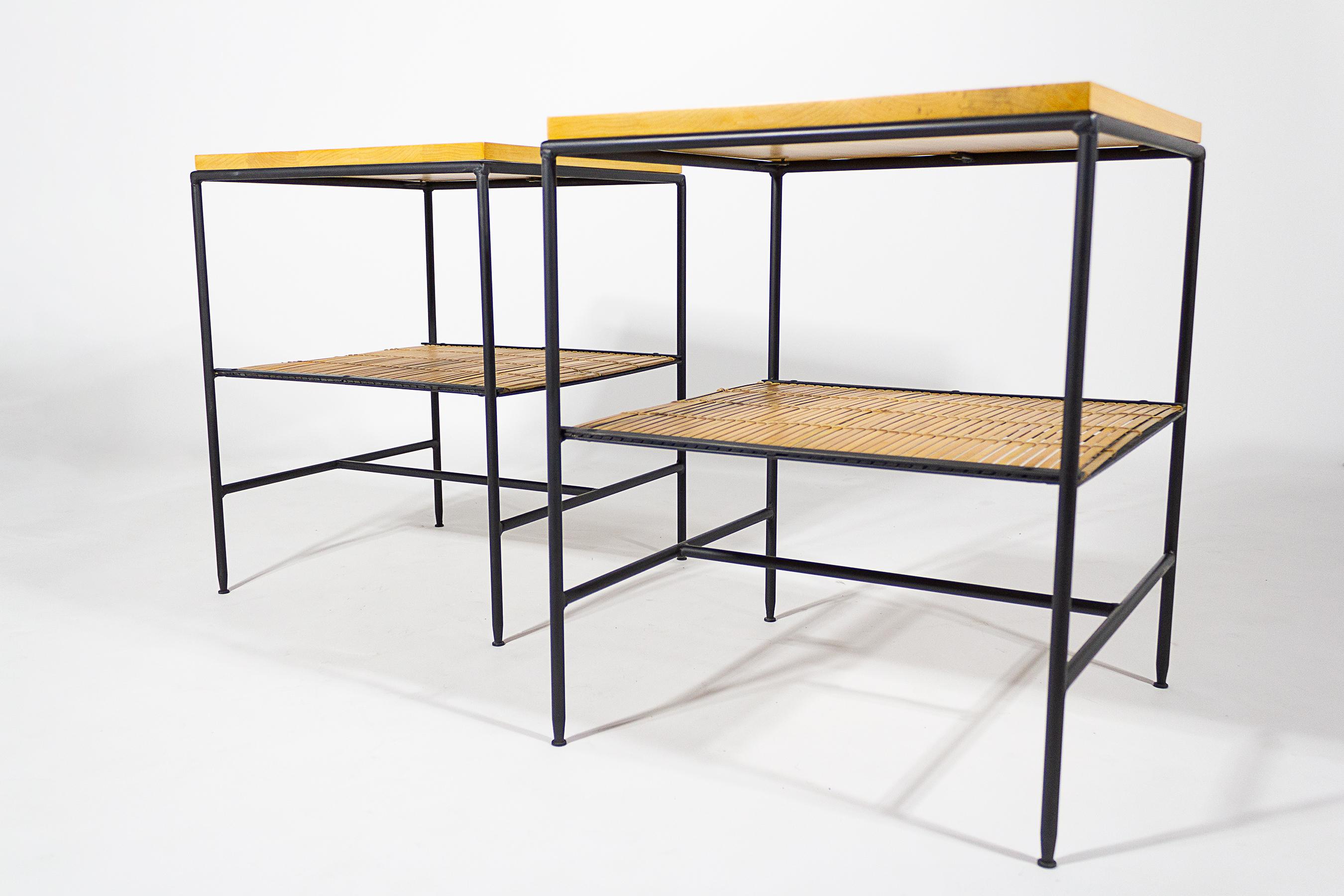 Pair of Planner Group series side tables designed by Paul McCobb for Winchendon. Tables are in excellent restored condition constructed with birch tops, iron, and reed.