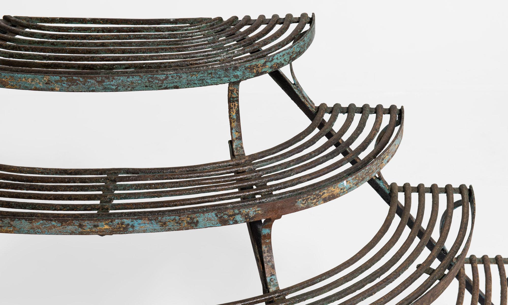 Plant stand by Arras Foundry, France, 19th century.

Semicircular iron stand with remnants of original paint.