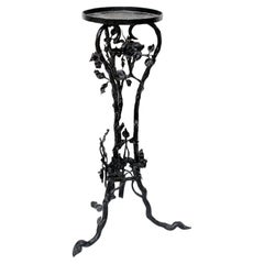 Plant table in wrought iron, with floral decorations (1900)