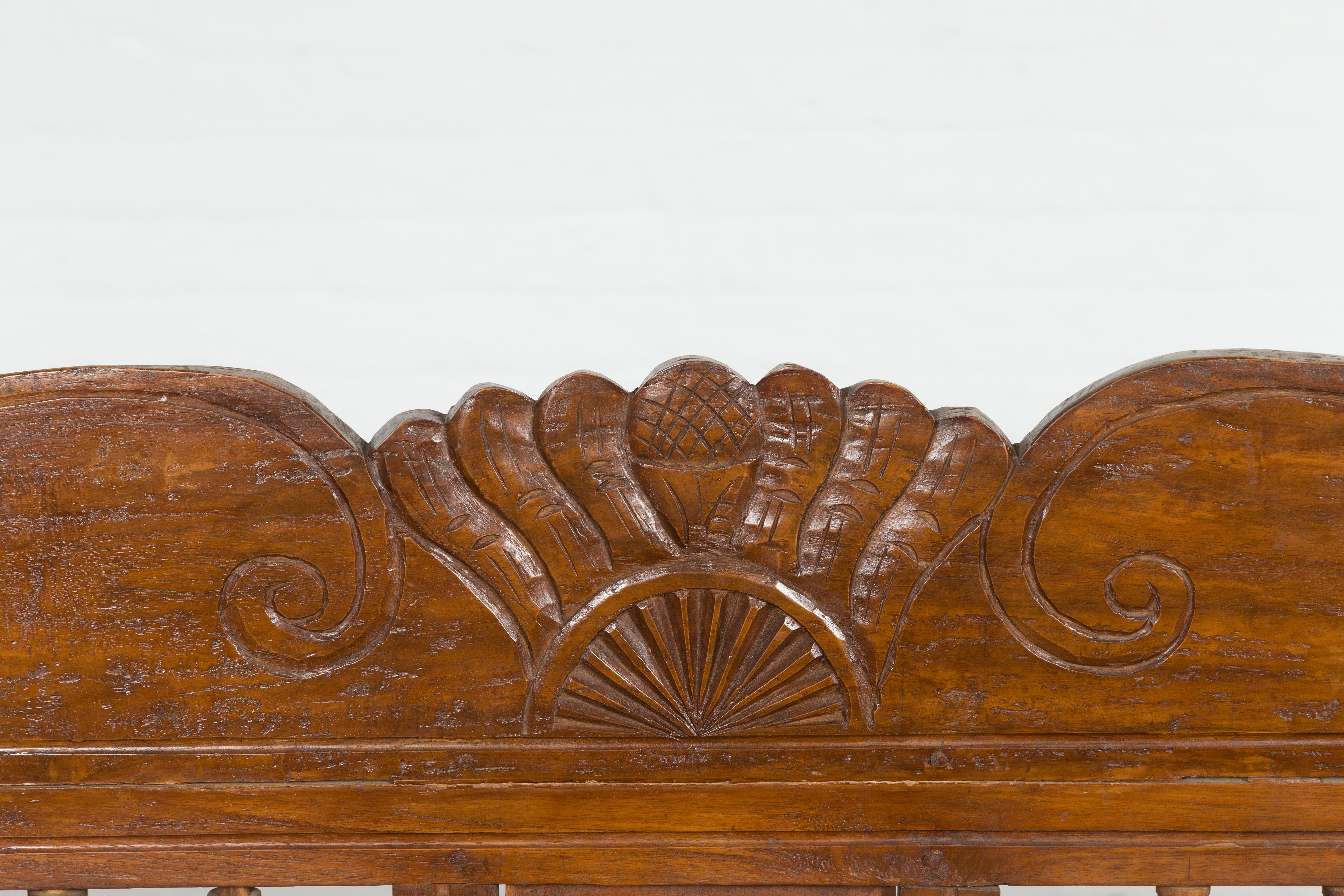 Javanese Teak Settee with Carved Décor and Out-Scrolling Arms For Sale 6