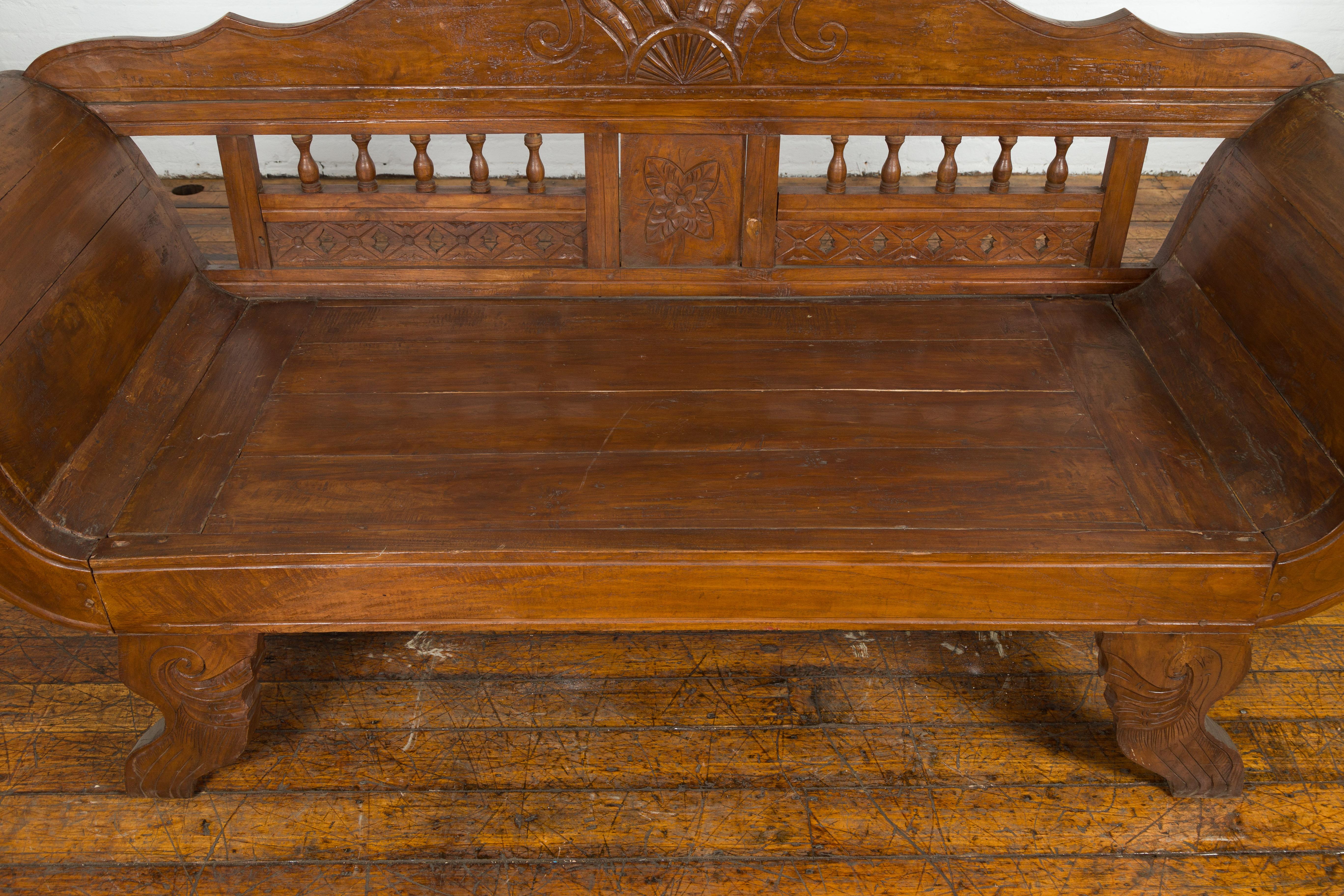 Javanese Teak Settee with Carved Décor and Out-Scrolling Arms For Sale 7