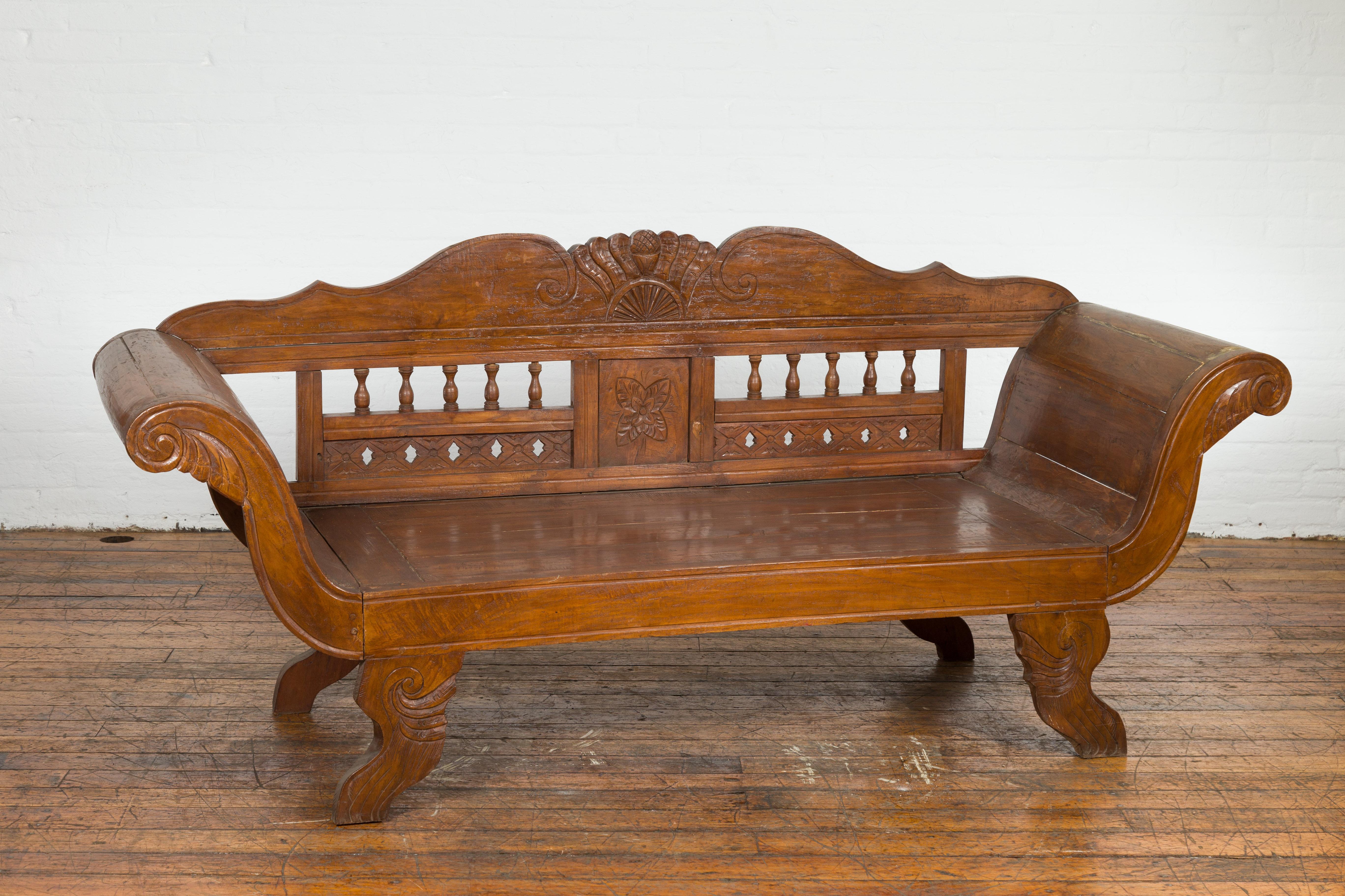Javanese Teak Settee with Carved Décor and Out-Scrolling Arms For Sale 9