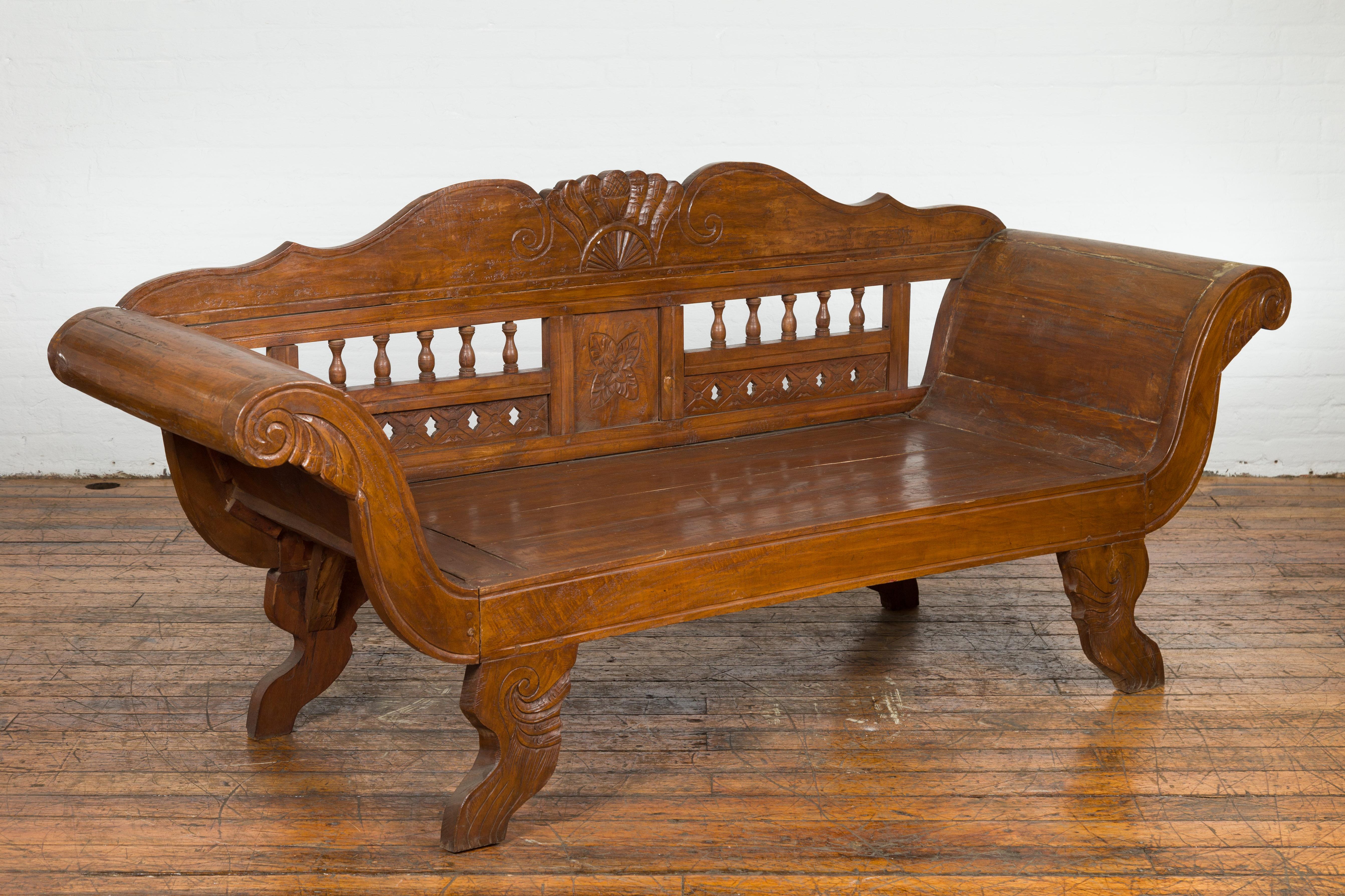Javanese Teak Settee with Carved Décor and Out-Scrolling Arms For Sale 10