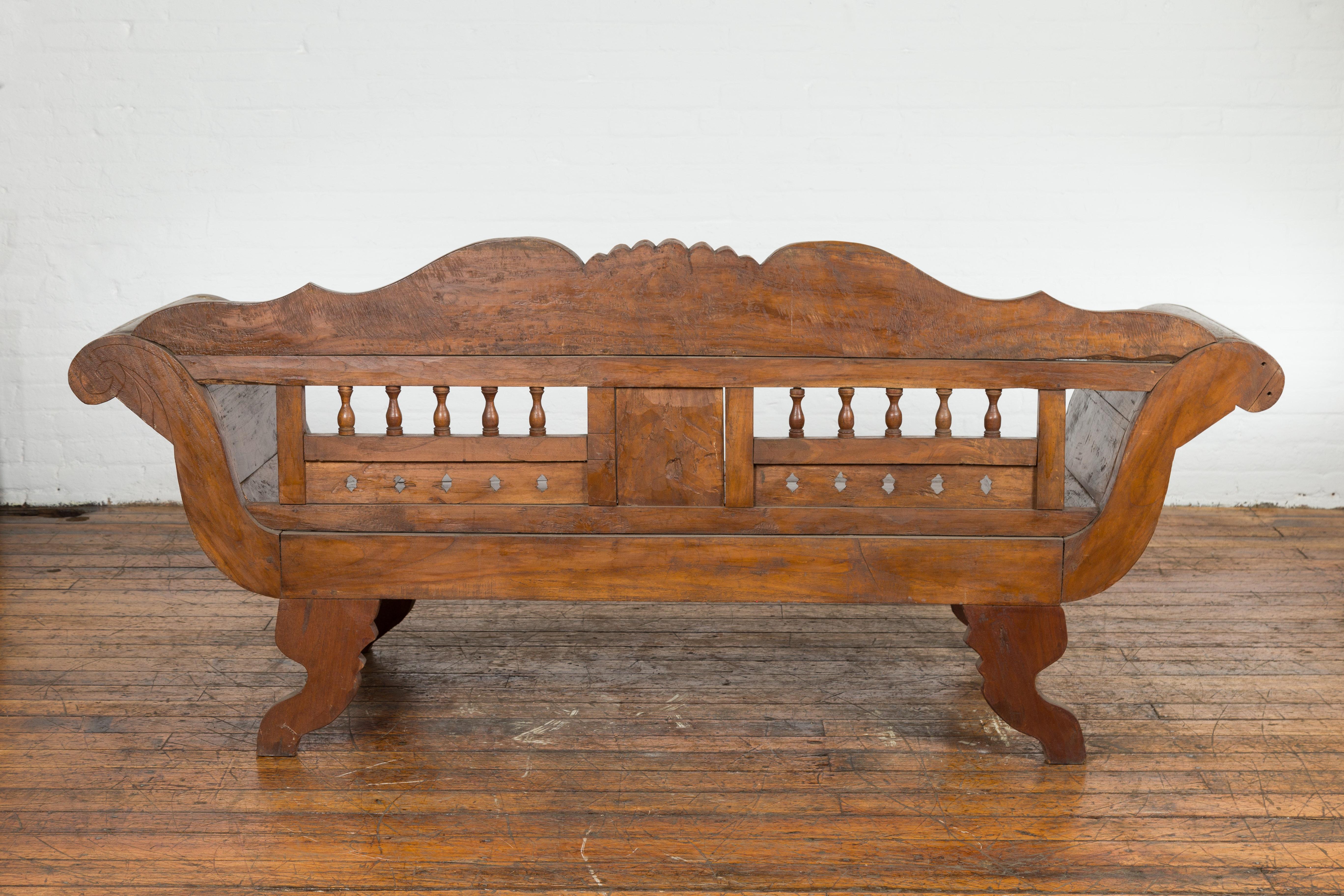 Javanese Teak Settee with Carved Décor and Out-Scrolling Arms For Sale 12