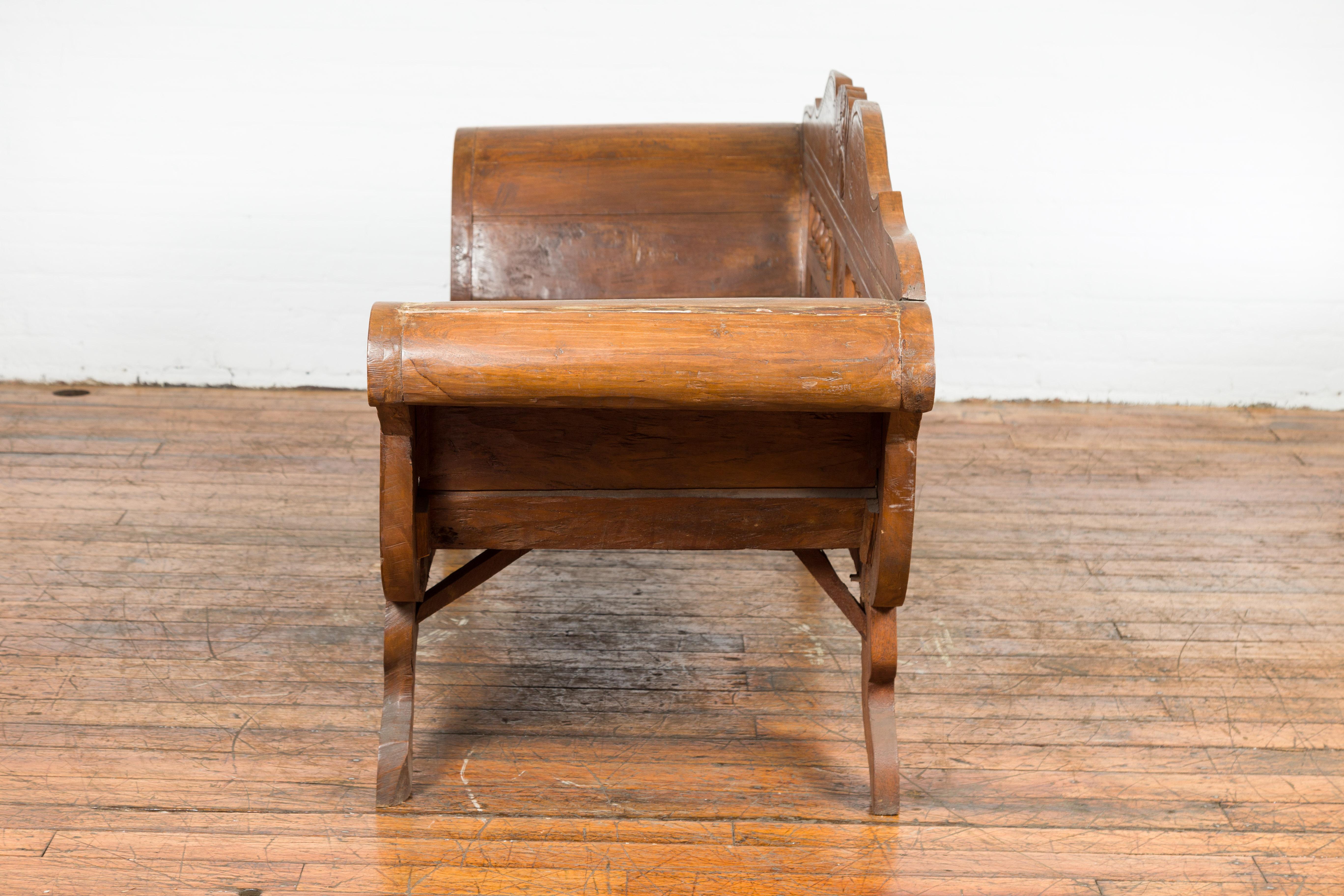 Javanese Teak Settee with Carved Décor and Out-Scrolling Arms For Sale 13
