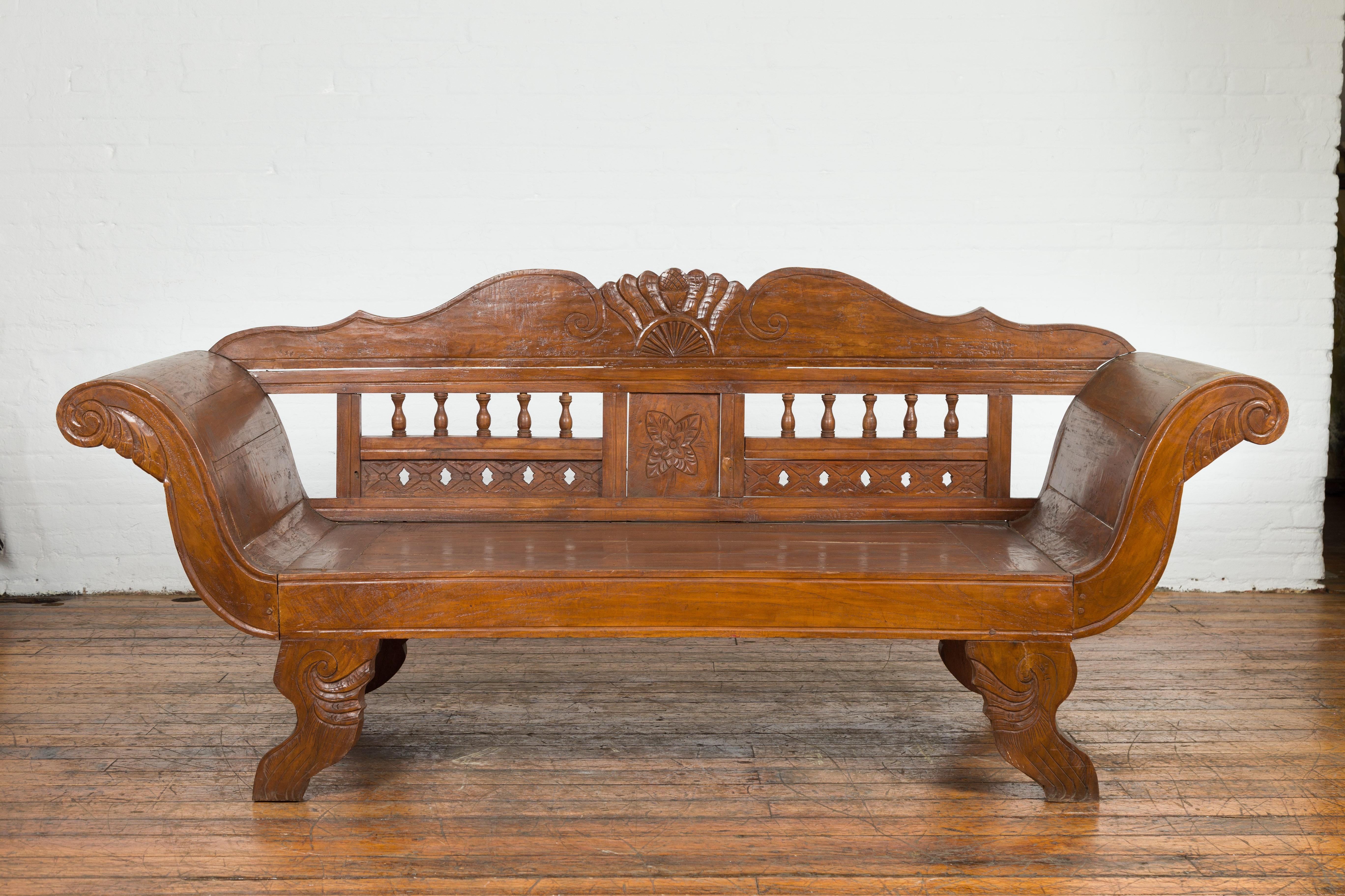 Javanese Teak Settee with Carved Décor and Out-Scrolling Arms In Good Condition For Sale In Yonkers, NY