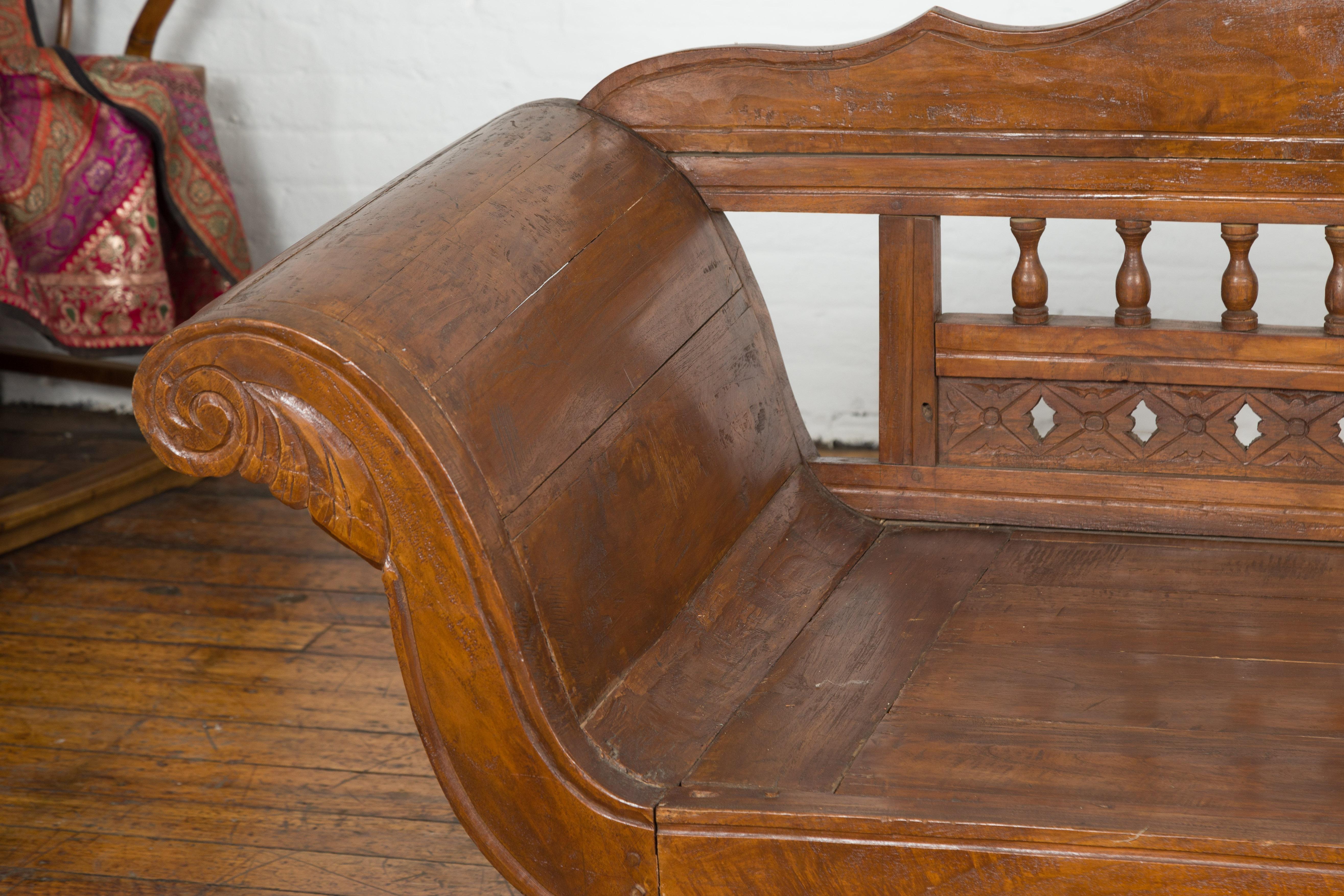 Javanese Teak Settee with Carved Décor and Out-Scrolling Arms For Sale 1