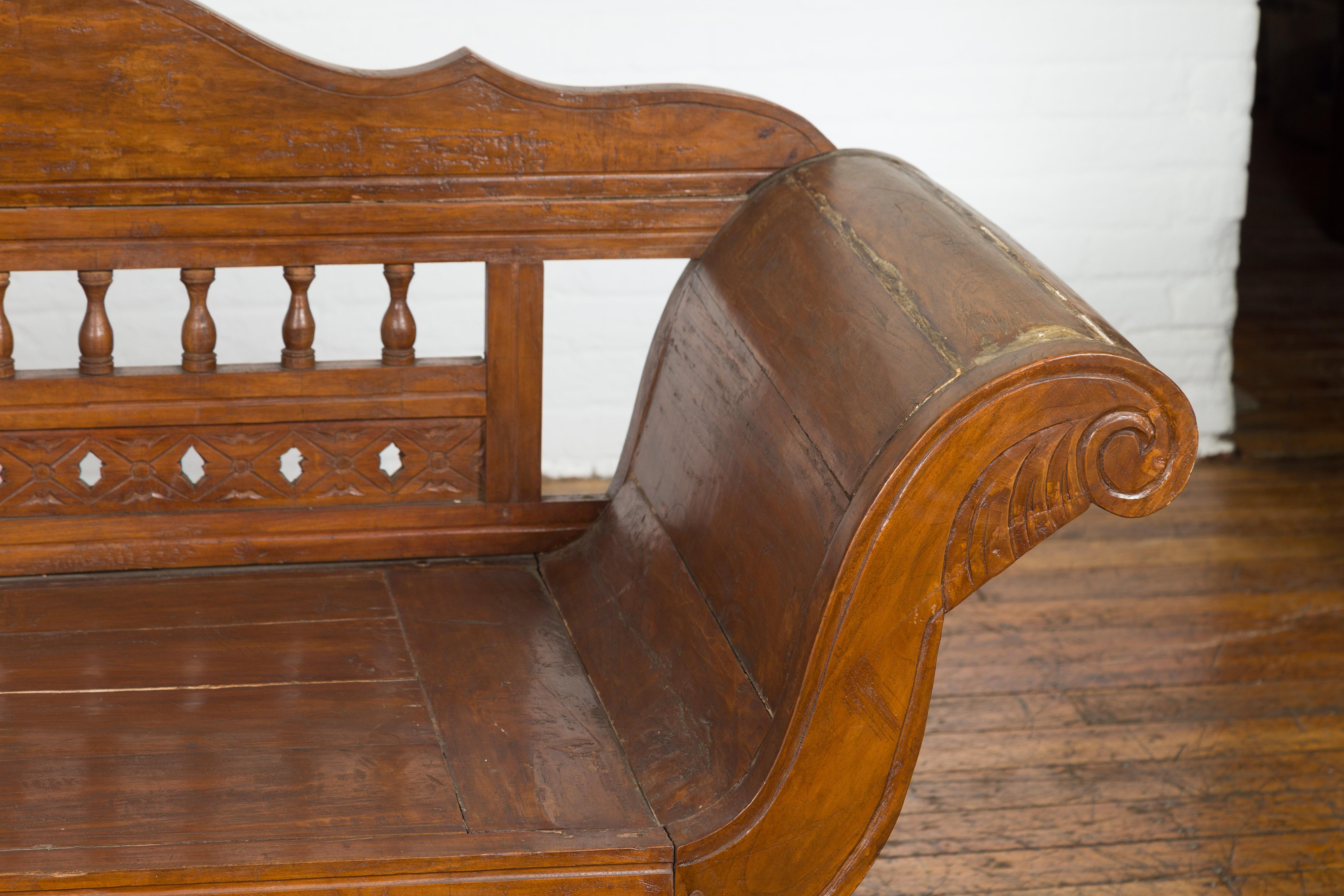 Javanese Teak Settee with Carved Décor and Out-Scrolling Arms For Sale 2