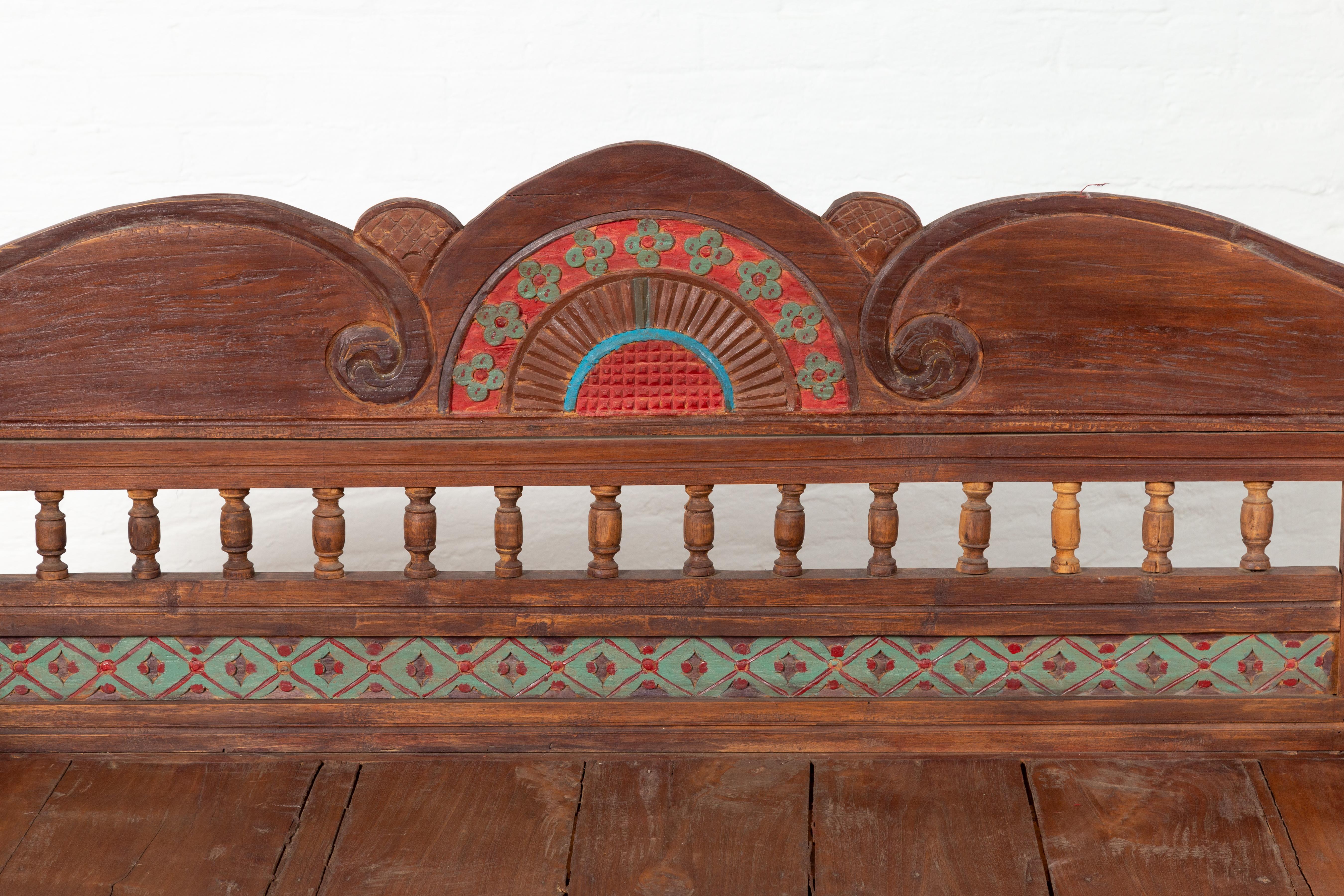 20th Century Plantation Javanese Teak Settee with Polychrome Décor and Out-Scrolling Arms For Sale