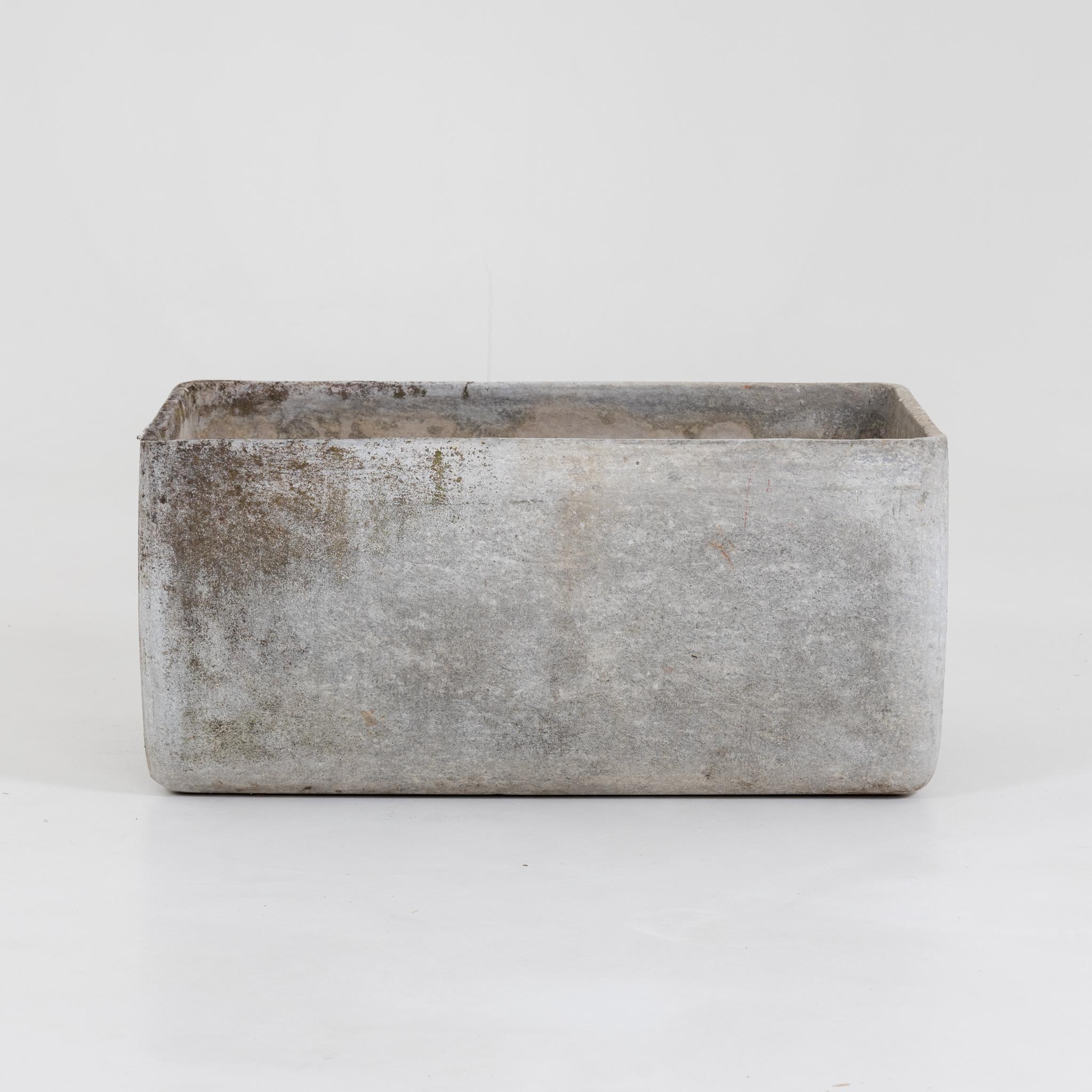 Rectangular planter bowl with concave indented bottom and convex wall. Signs of age and use.