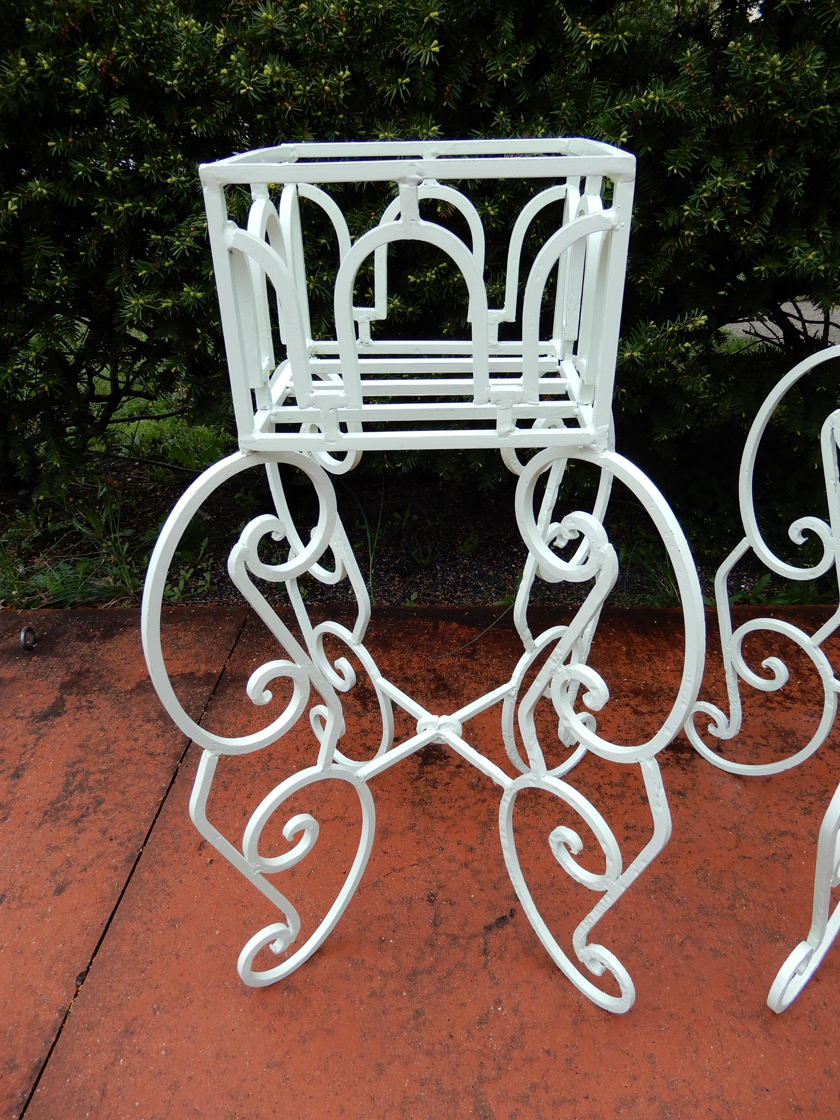 A pair of ornate wrought iron planters, unique design and possibly one of a kind, ready to show your favorite plants in, Just sandblasted and repainted, with no breaks or repairs. These are priced and sold as a pair