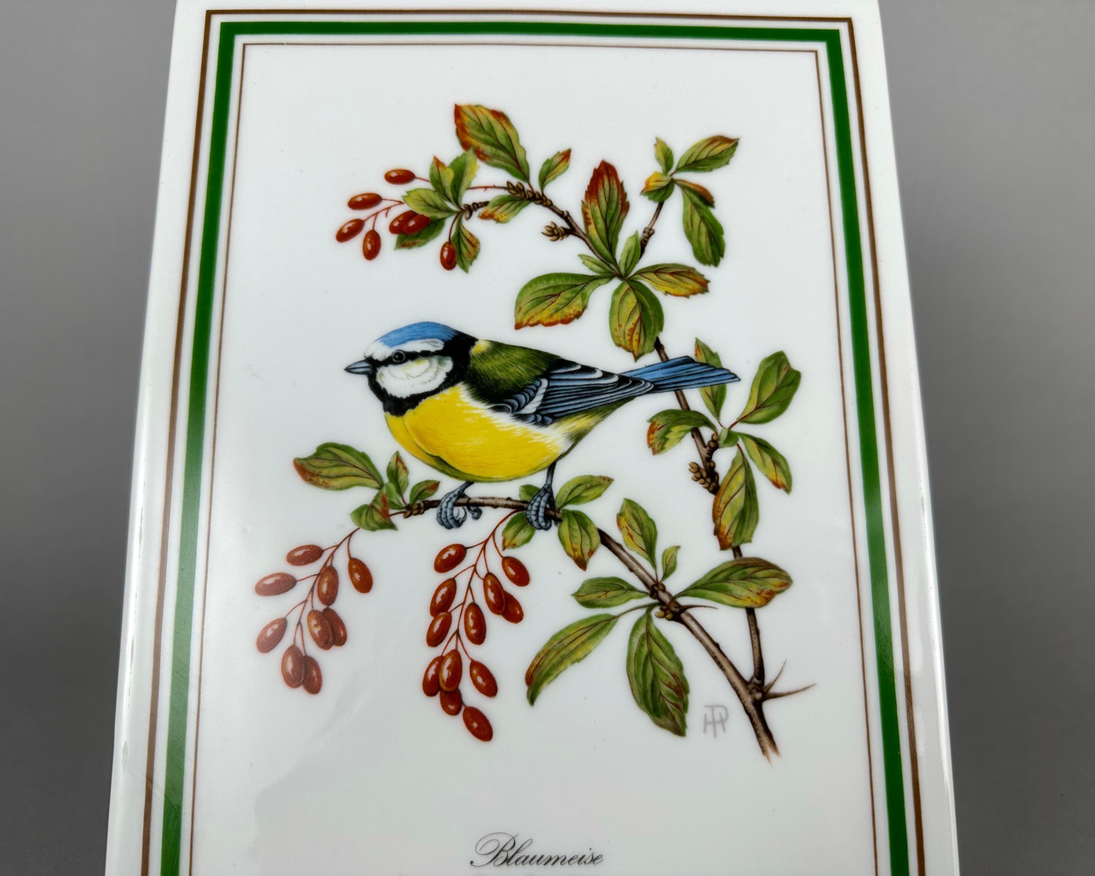 Beautiful Royal Tettau porcelain plaque featuring the Parus Caeruleus from their European Singing Bird collection.

This limited edition series was produced in 1972 and 1973 in Bavaria, Germany.

A porcelain wall plaque is an ideal way to decorate