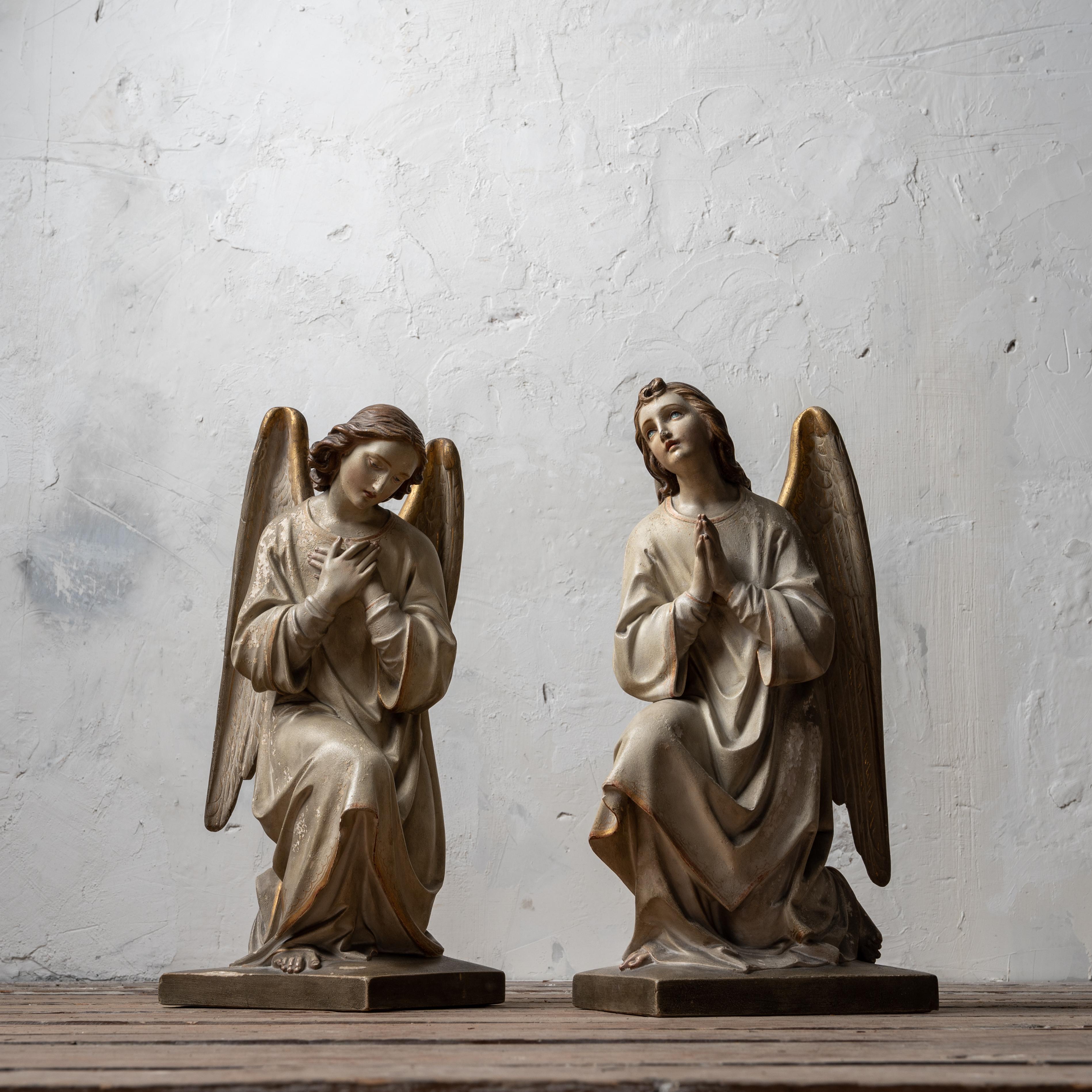 A pair of polychromed plaster altar angels, France or Belgium, late 19th century.

11 inches wide by 10 inches deep by 20 ¼ inches tall

