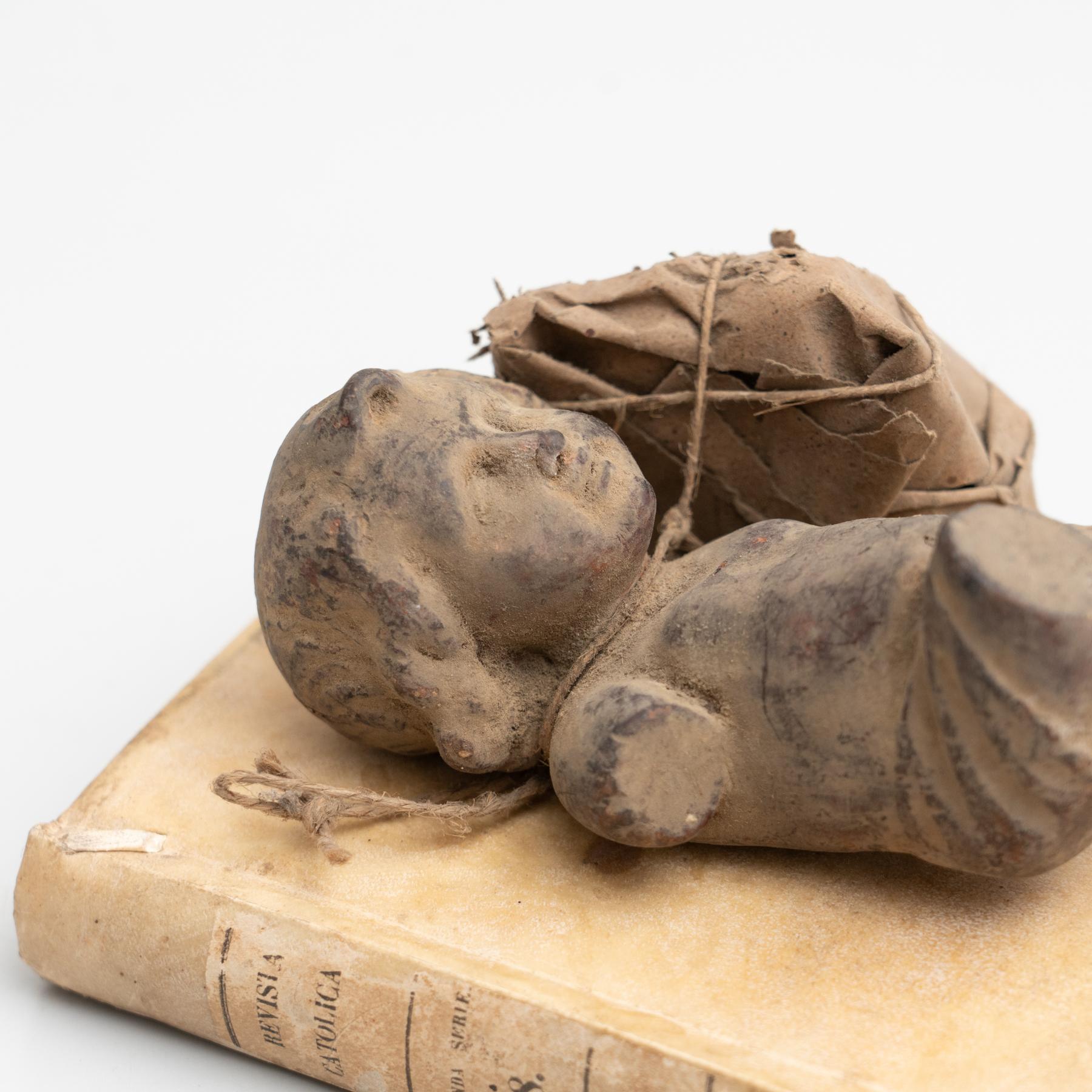 Spanish Plaster Baby Jesus and Antique Book Sculptural Artwork, circa 1950 For Sale