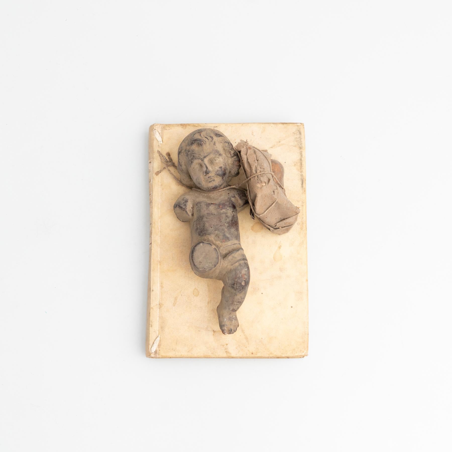 Plaster Baby Jesus and Antique Book Sculptural Artwork, circa 1950 In Good Condition For Sale In Barcelona, Barcelona