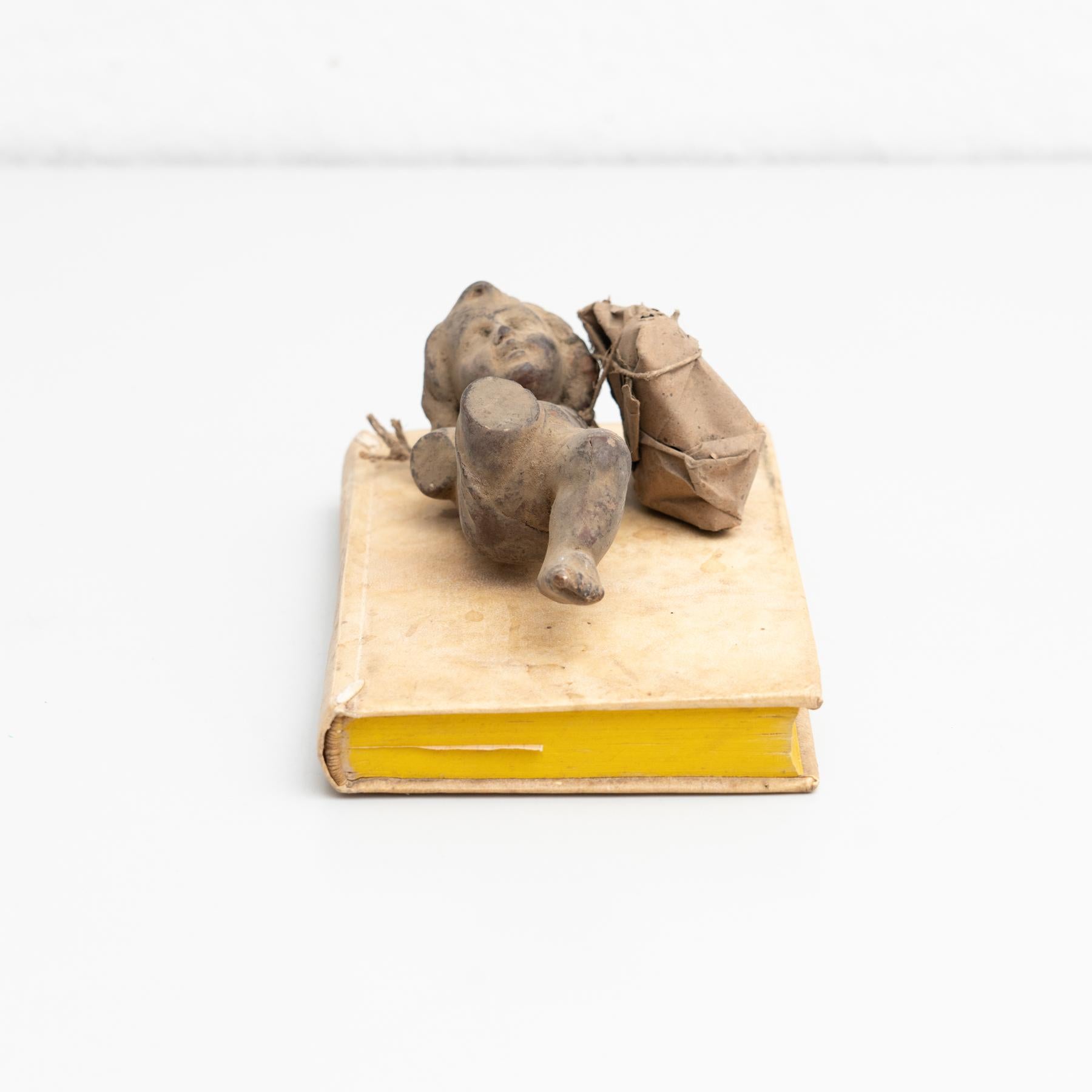 Mid-20th Century Plaster Baby Jesus and Antique Book Sculptural Artwork, circa 1950 For Sale
