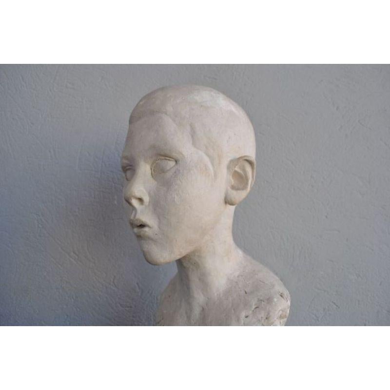 Patinated Plaster Bust of a Child, circa 1900 For Sale
