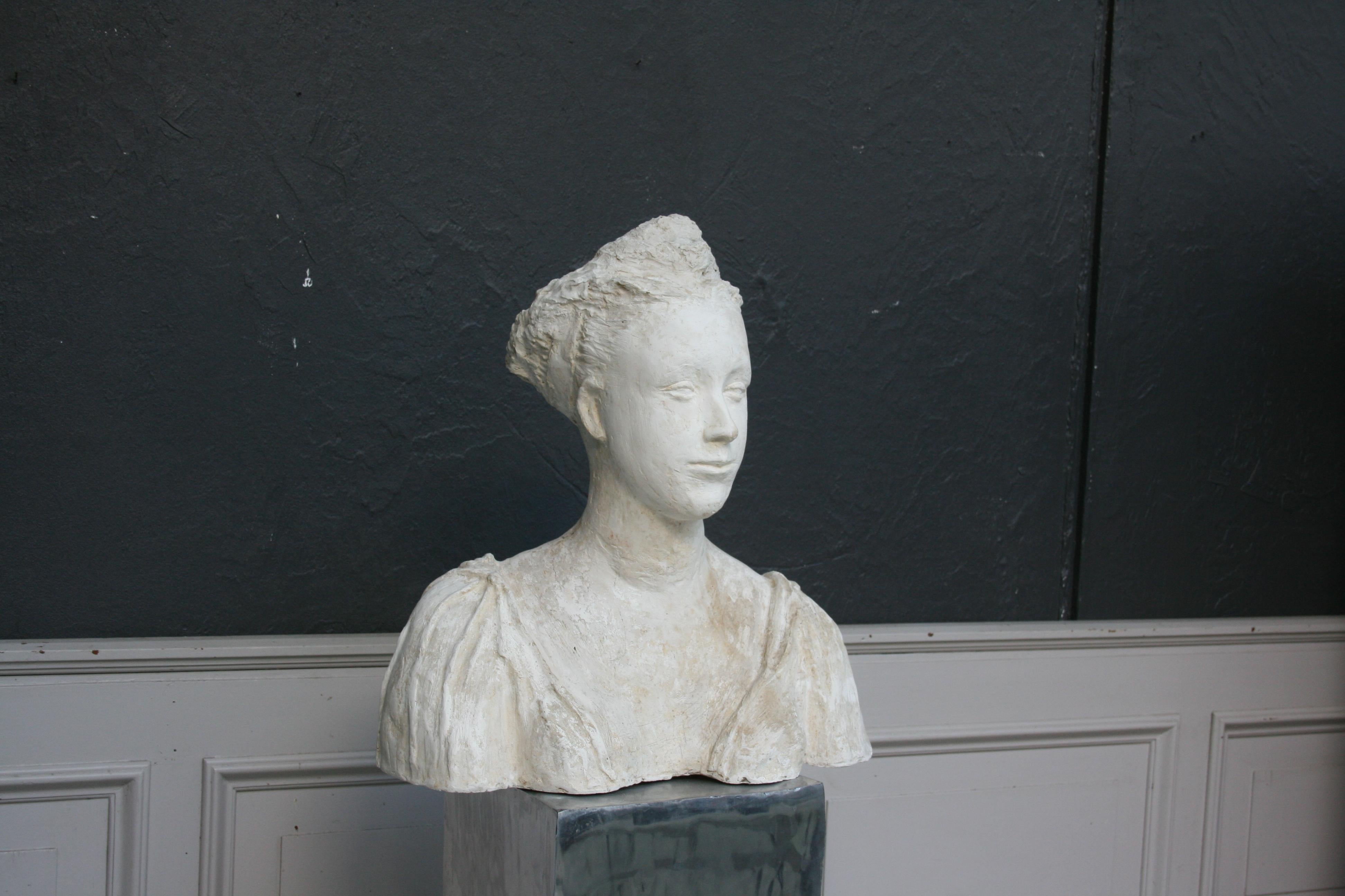 Original hand-sculpted plaster bust of a young woman. From France, circa 1930.