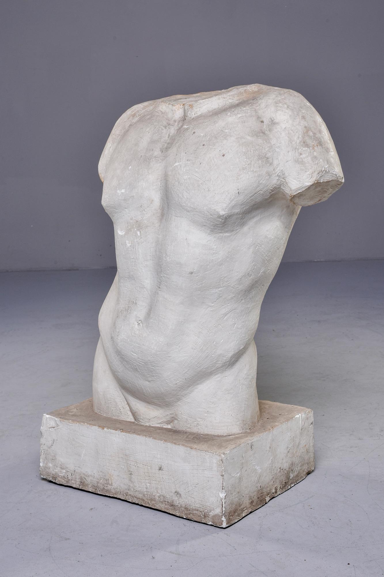 Found in France, this classical study in plaster of male torso has built in base and stands just under two and half feet tall. Unknown age and maker. Very good vintage condition.