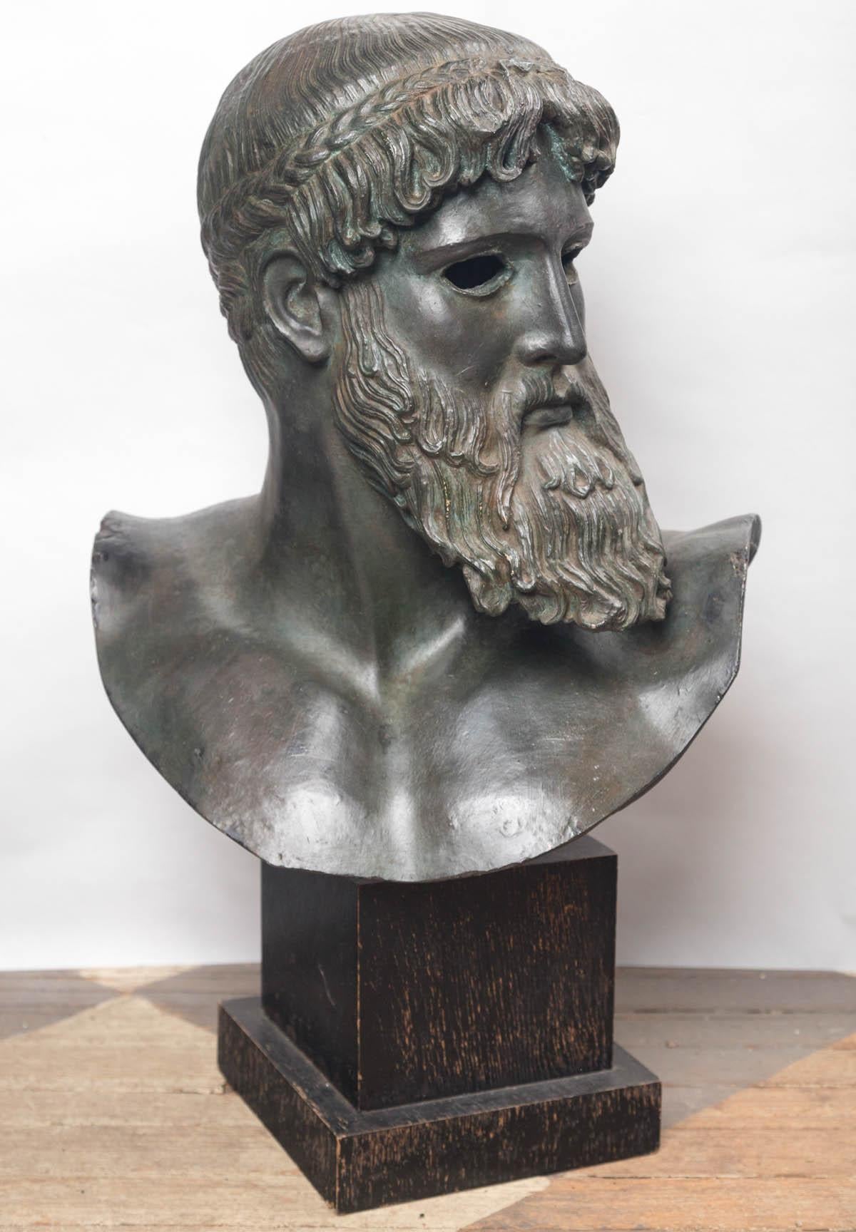 After the antique, sometimes also known as a bust of Zeus. This head is a copy from one full figure statue of Poseidon in the act of throwing a spear. It as a painted finish, and waxed to simulate bronze. The bust alone is 18 inches tall. It is