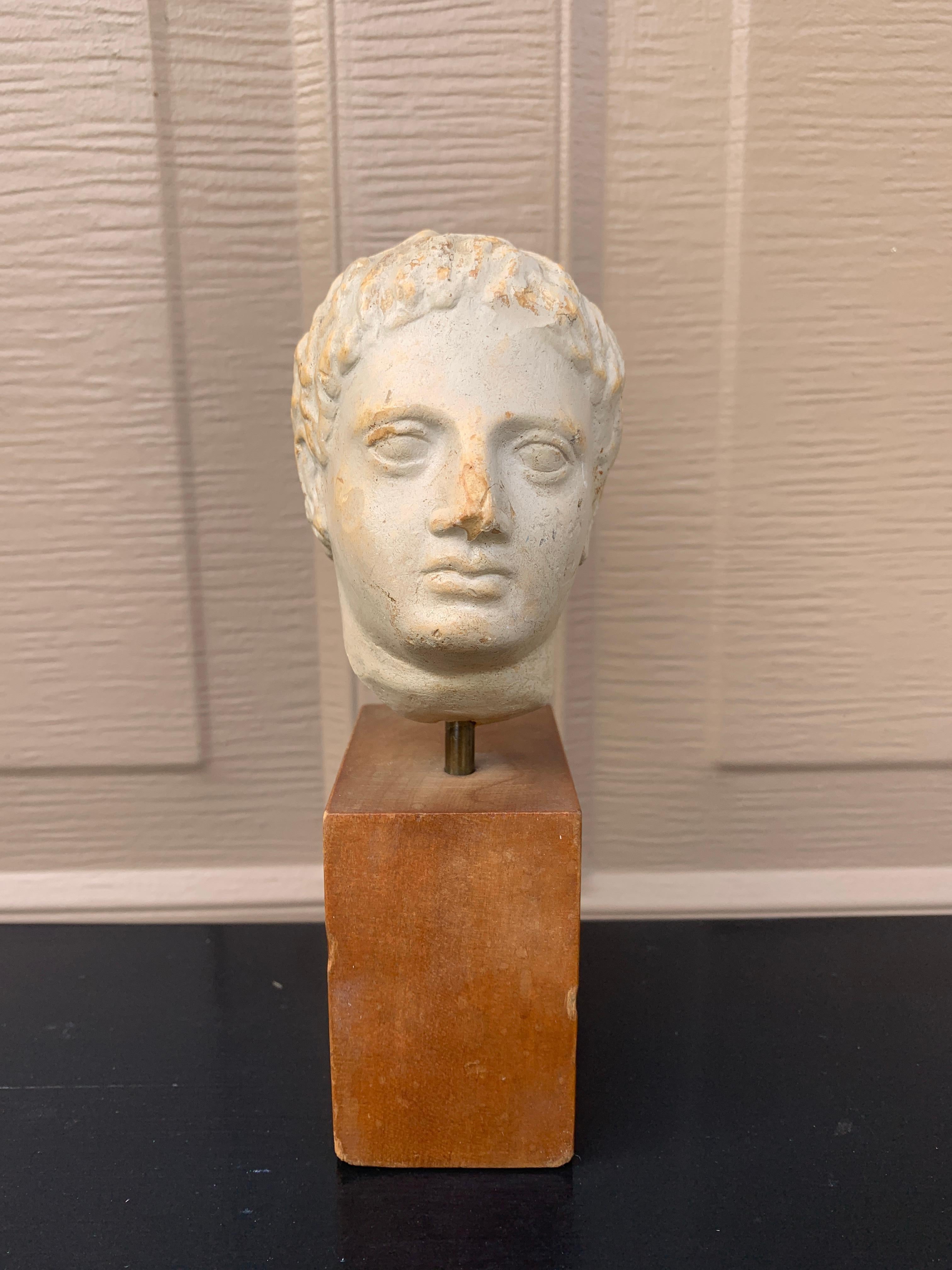 A gorgeous bust of Roman emperor Augustus.

USA, Circa mid-20th century

Plaster bust on wood pedestal base

Measures: 2.75