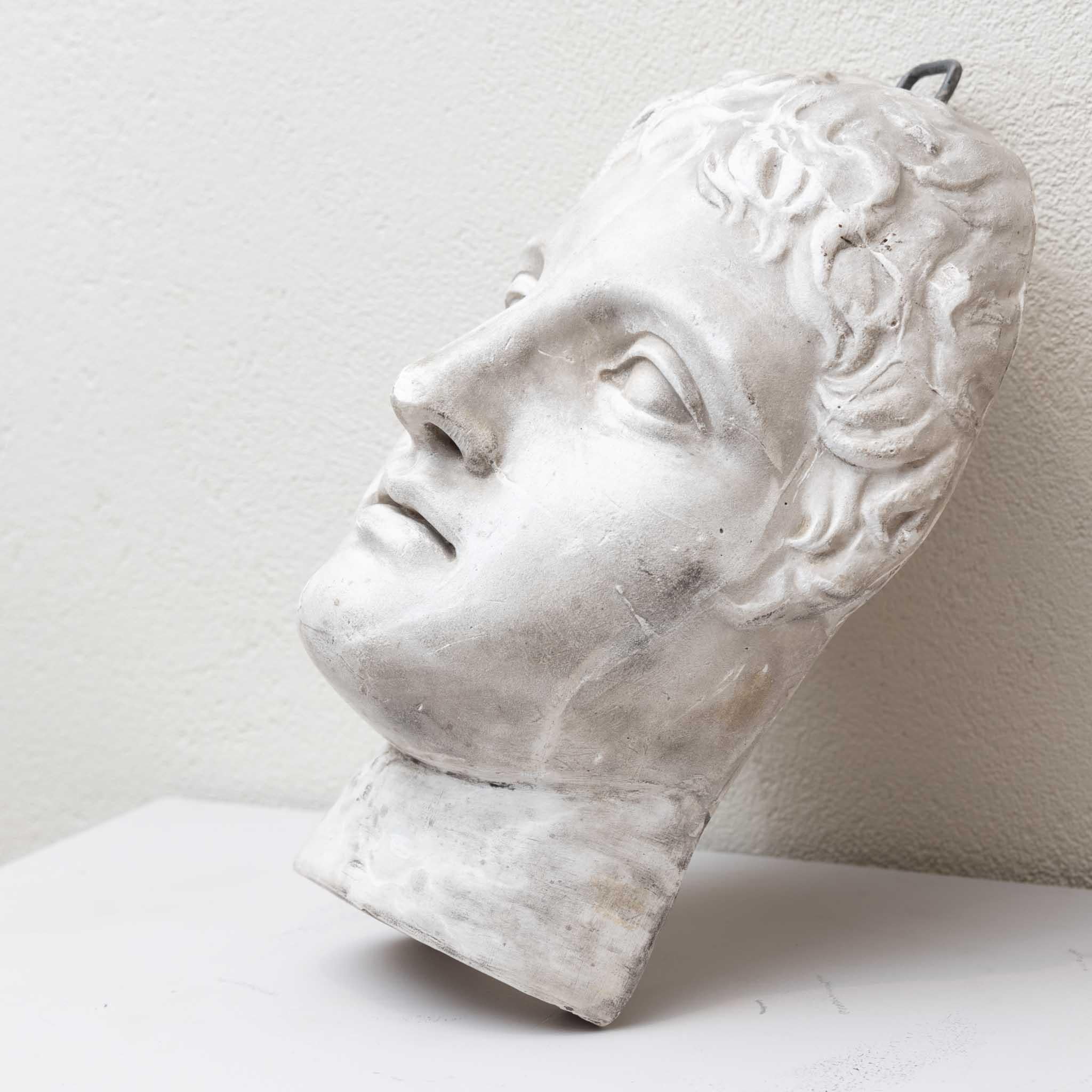 Expressive plaster cast of a man's mask made after an antique model. 
Provenance: formerly Hohenzollernschloss Sigmaringen.