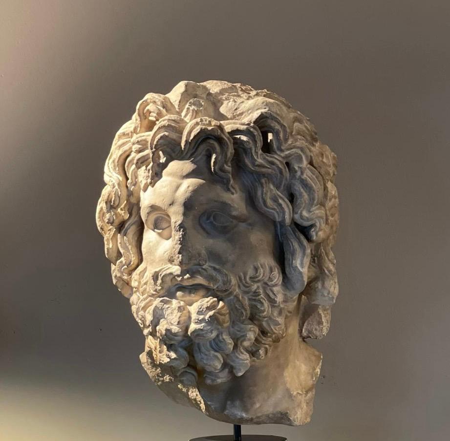 Plaster Cast of Zeus (Late 1970s, Italy)

This plaster cast represents the Greek god Zeus (known as Jupiter in Roman mythology), embodying the classic depiction of a bearded, curly-haired figure symbolizing divine authority. Crafted in plaster in