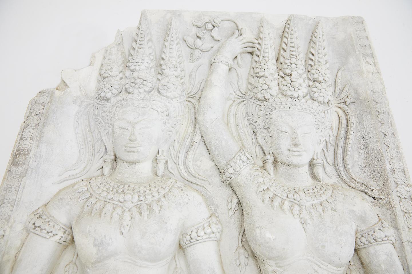 A plaster cast panel museum copy of a temple carving from Angkor Wat Cambodia, depicting Apsara dancing girls. European copy circa 1900.