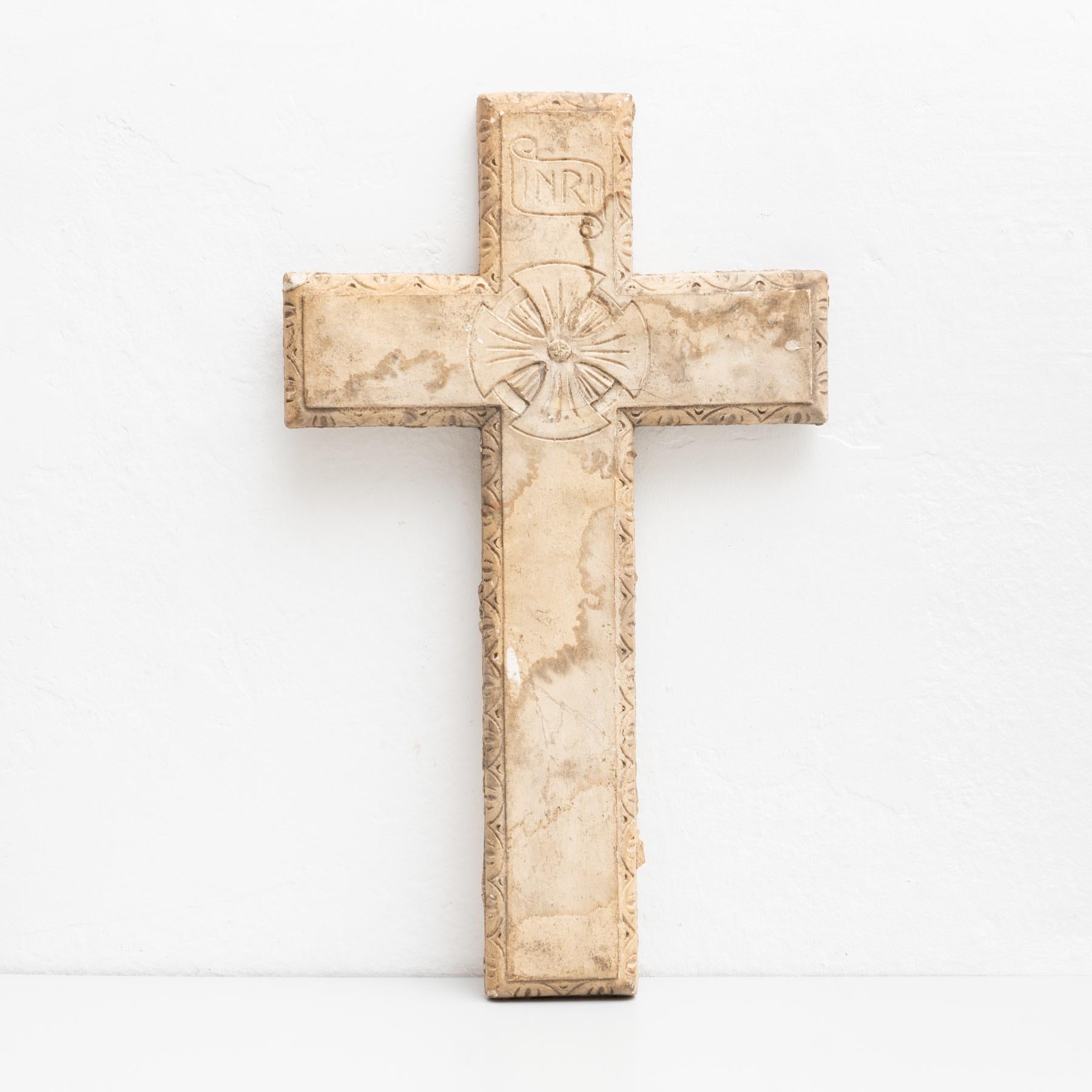Traditional religious plaster wall artwork of a cross.

Made in traditional Catalan atelier in Olot, Spain, circa 1950.

Olot has a long tradition in the production of sculptures and religious imagery. The art and industry of religious statuary
