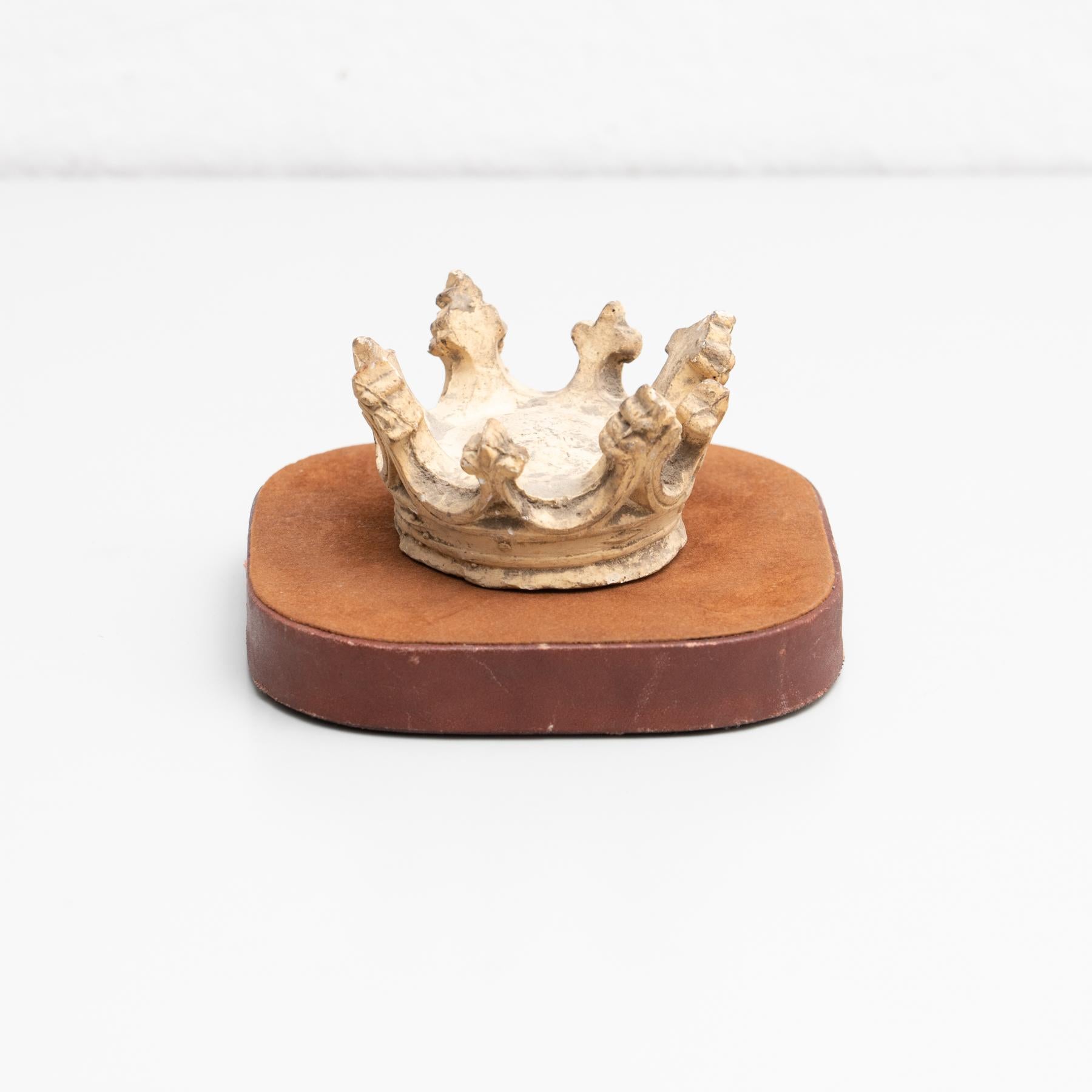 Plaster crown on a stand artwork.

Made in traditional Catalan atelier in Olot, Spain, circa 1950.

Olot has a long tradition in the production of sculptures and religious imagery. The art and industry of religious statuary has been established
