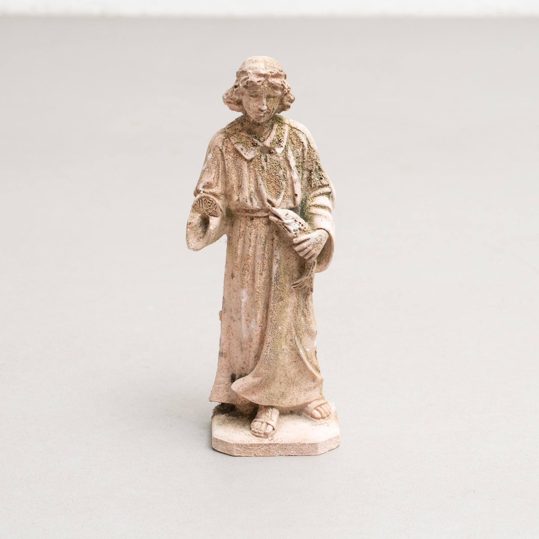 Traditional religious plaster figure of a young Jesus with a fish.    Made in traditional Catalan atelier in Olot, Spain, circa 1950.    In original condition, with minor wear consistent with age and use, preserving a beautiful patina.    Olot has a